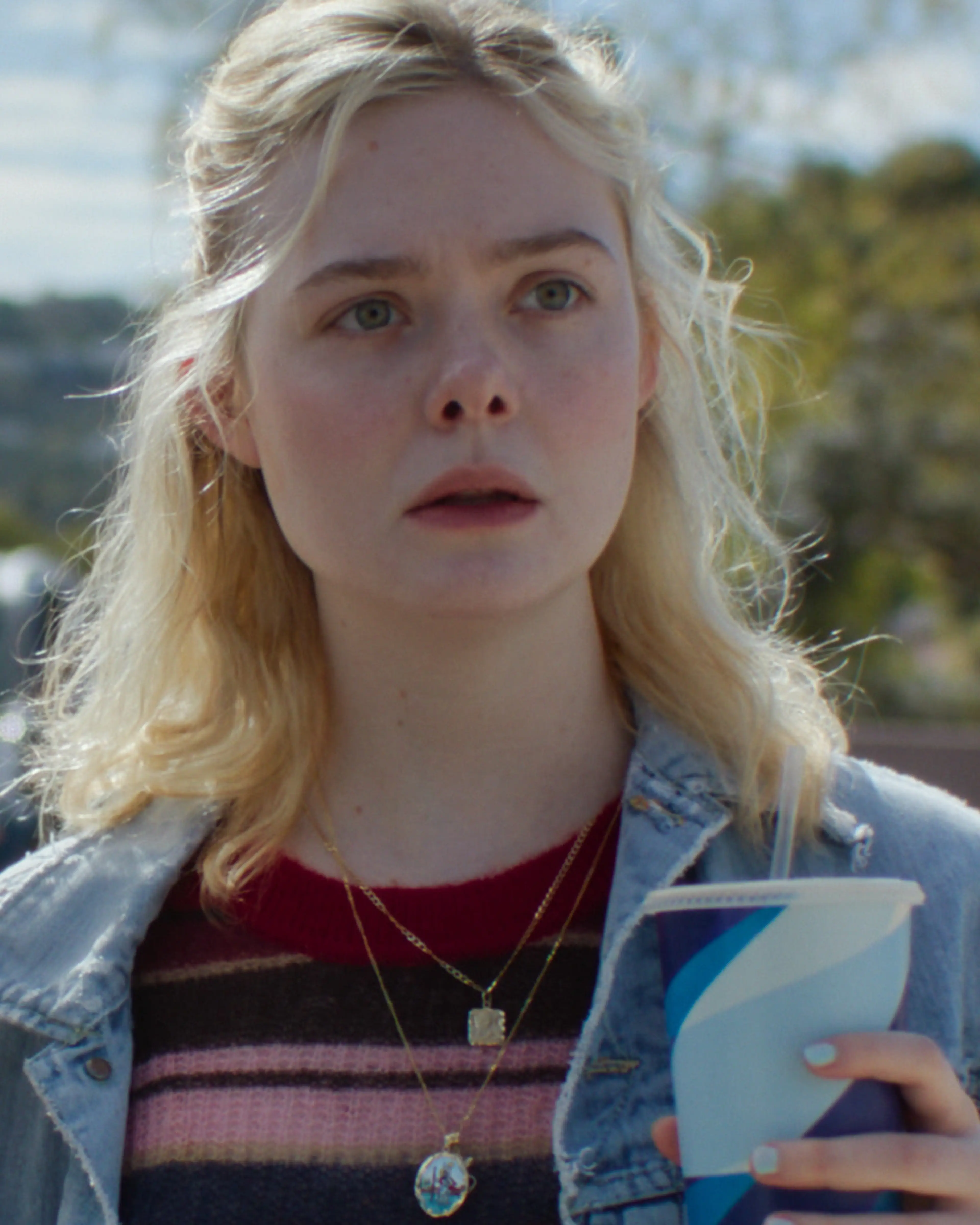 Elle Fanning as Margo, with her face clearly visible.