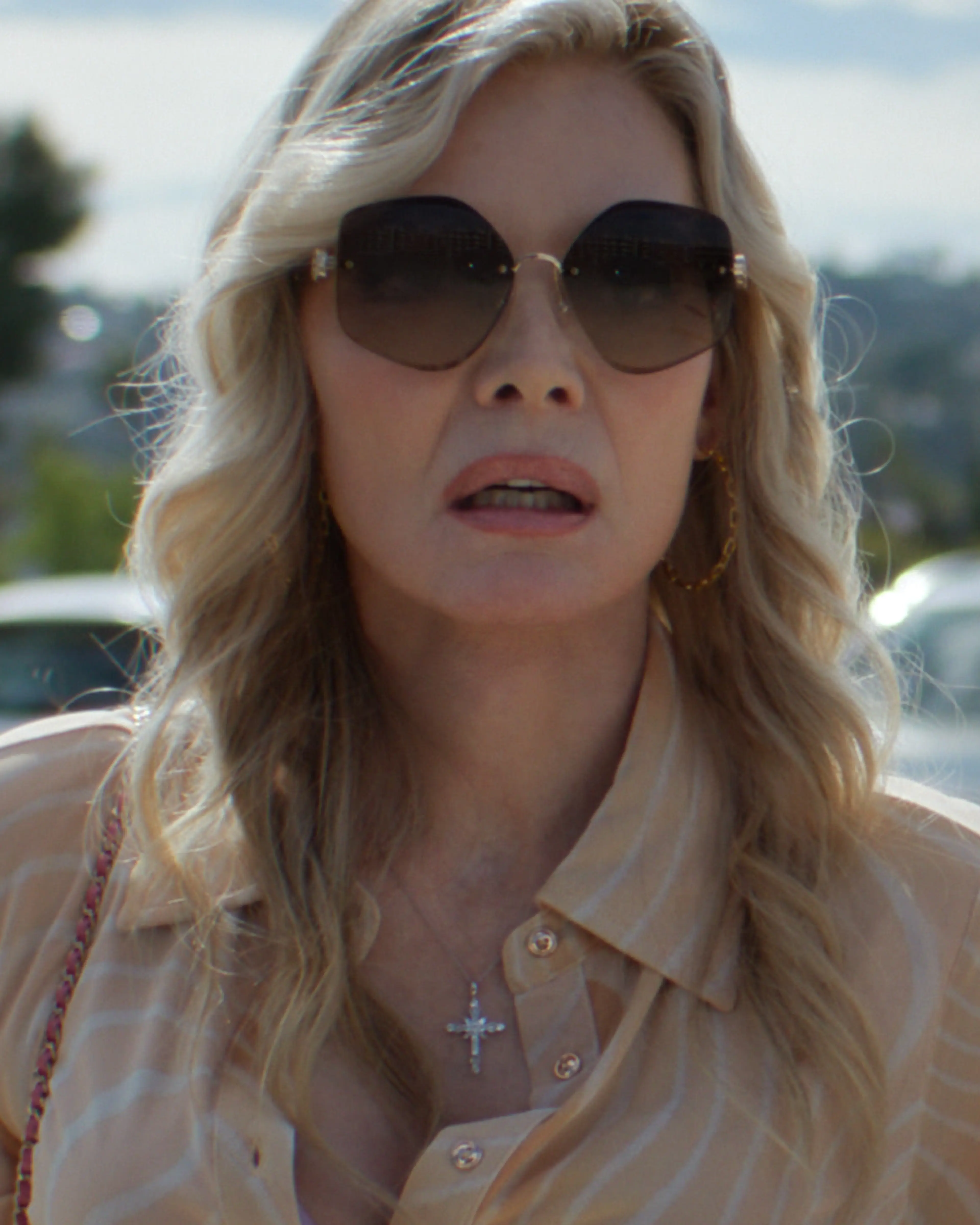 Michelle Pfeiffer as Shyanne, wearing sunglasses.