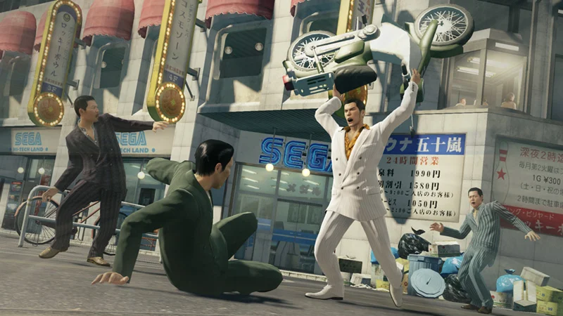 Official SEGA Yakuza 0 gameplay screenshot of Kiryu lifting a motorcycle over his head in Beast style on a city street.