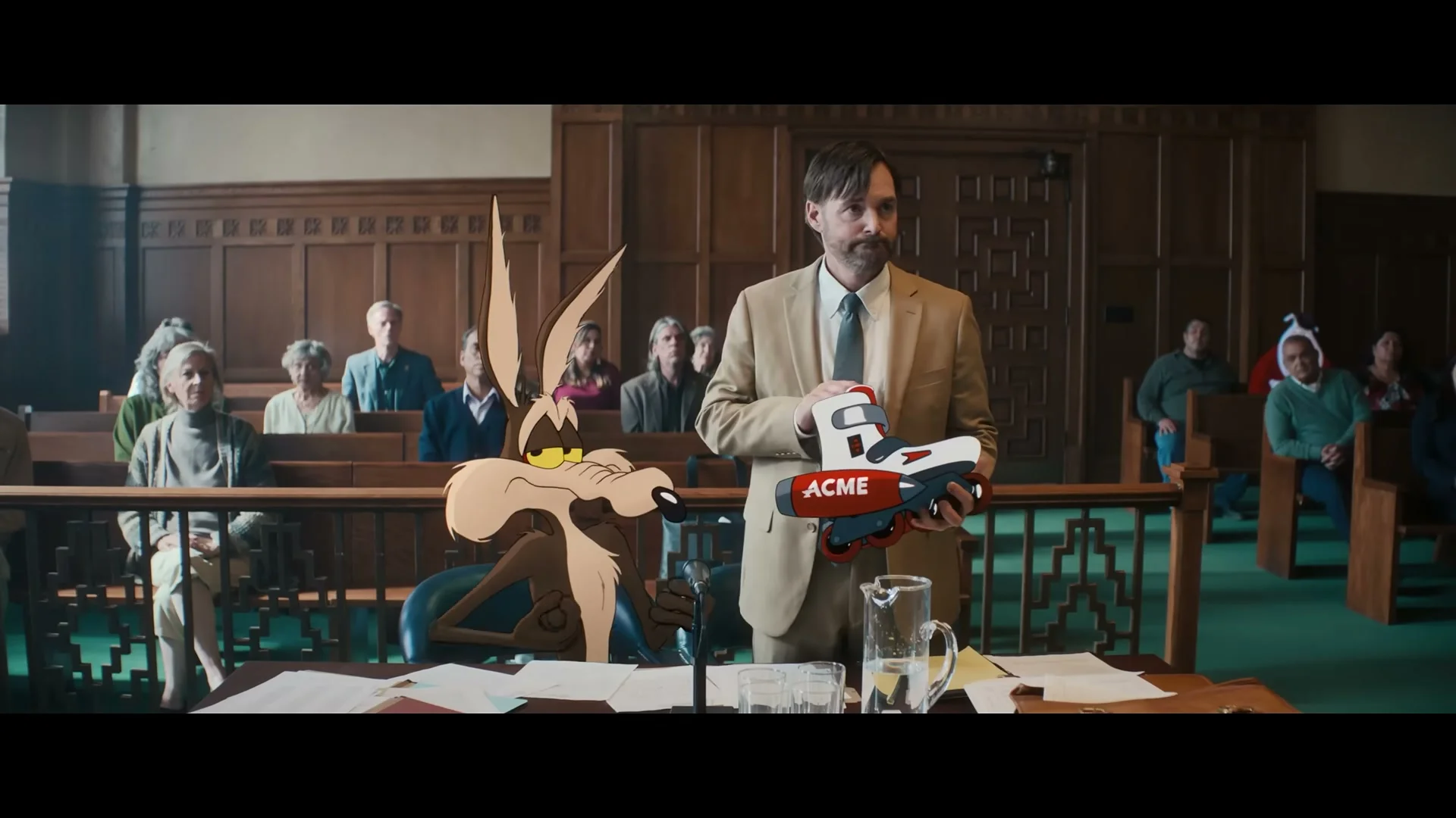 Wile E. Coyote sits beside Kevin Avery during a courtroom hearing in Coyote vs. Acme.