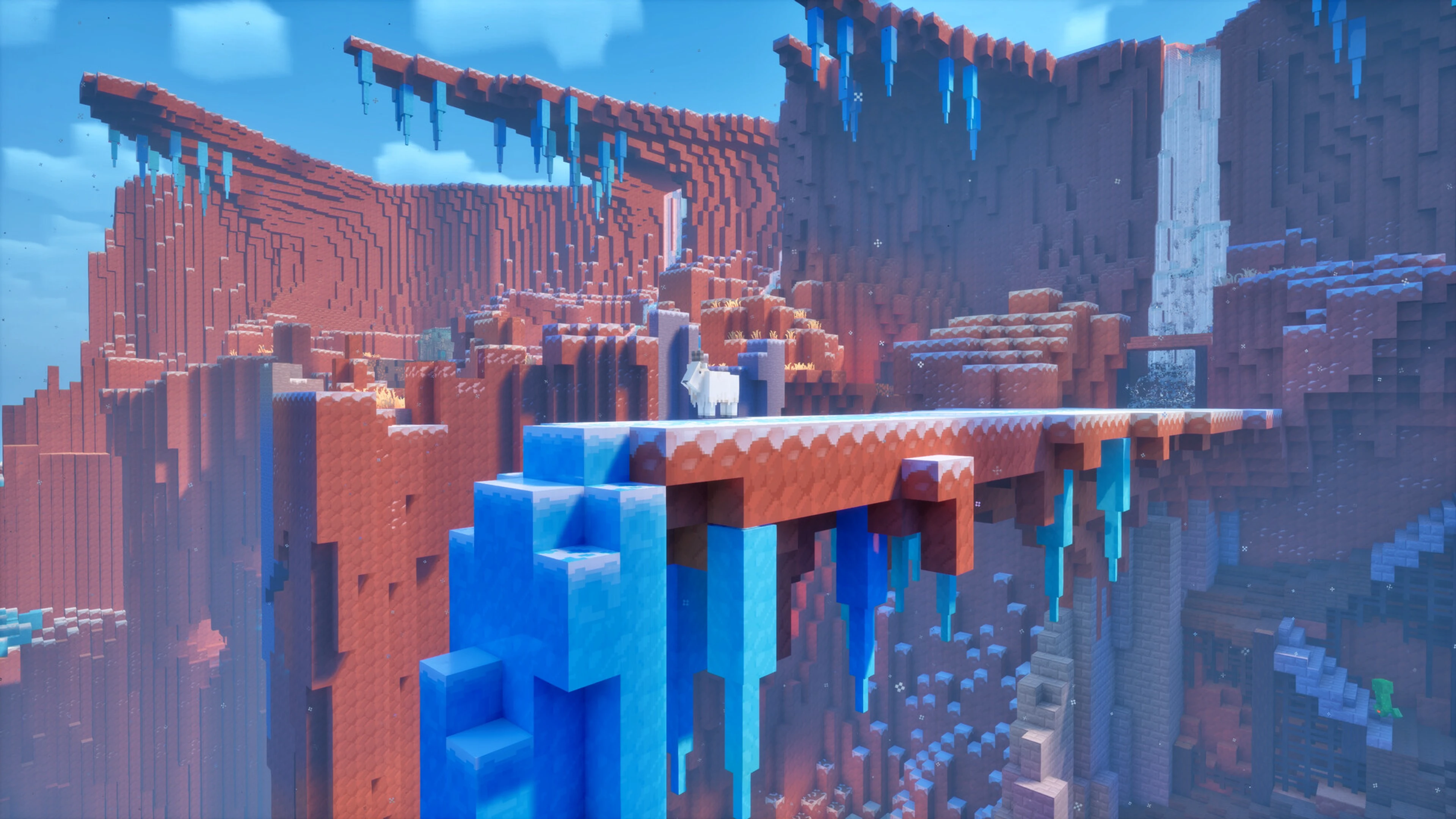 Minecraft Dungeons II heroes cross a wooden bridge above a canyon.