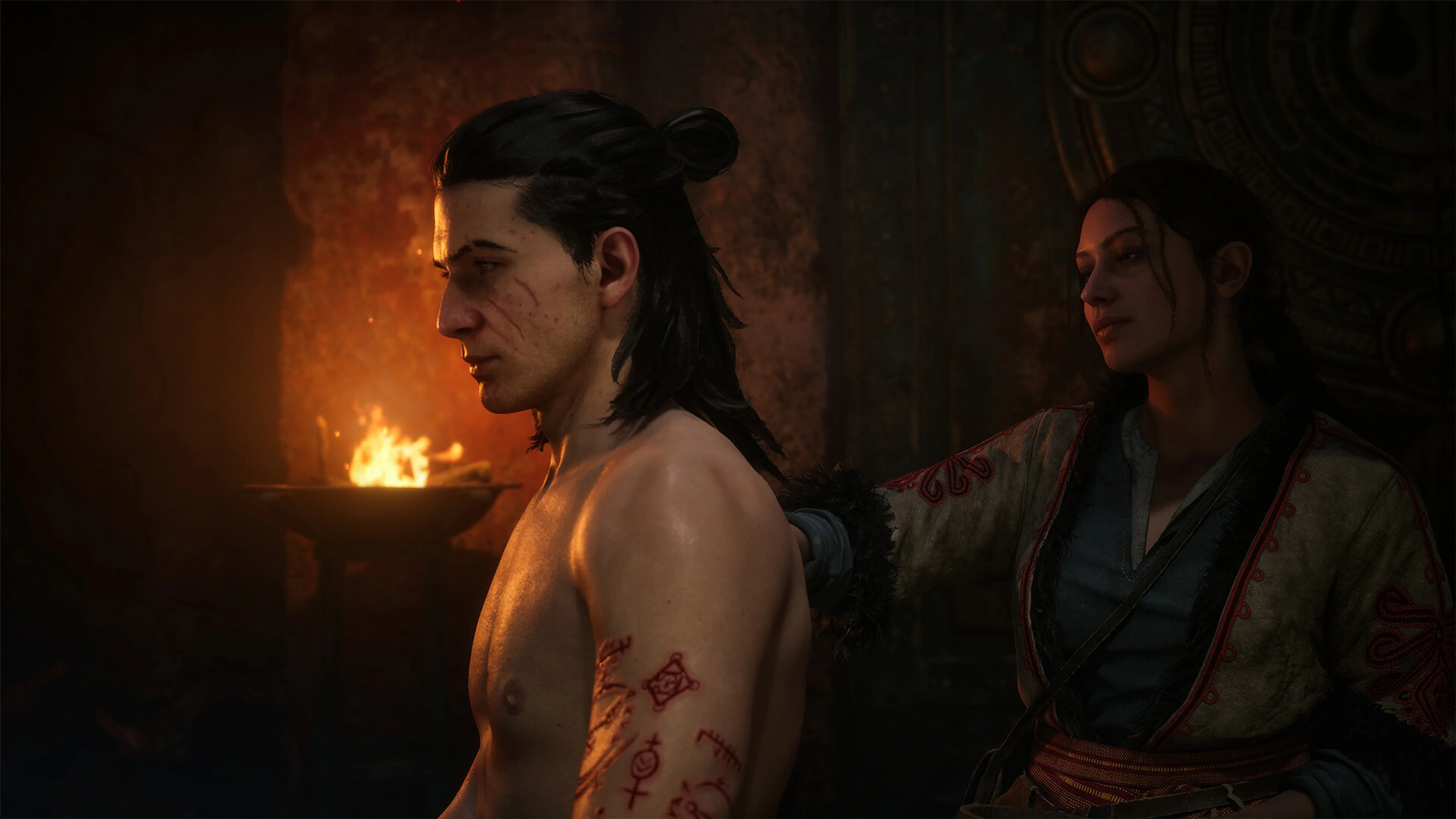 Red witchcraft runes cover Coen's arm while a woman stands behind him in The Blood of Dawnwalker.