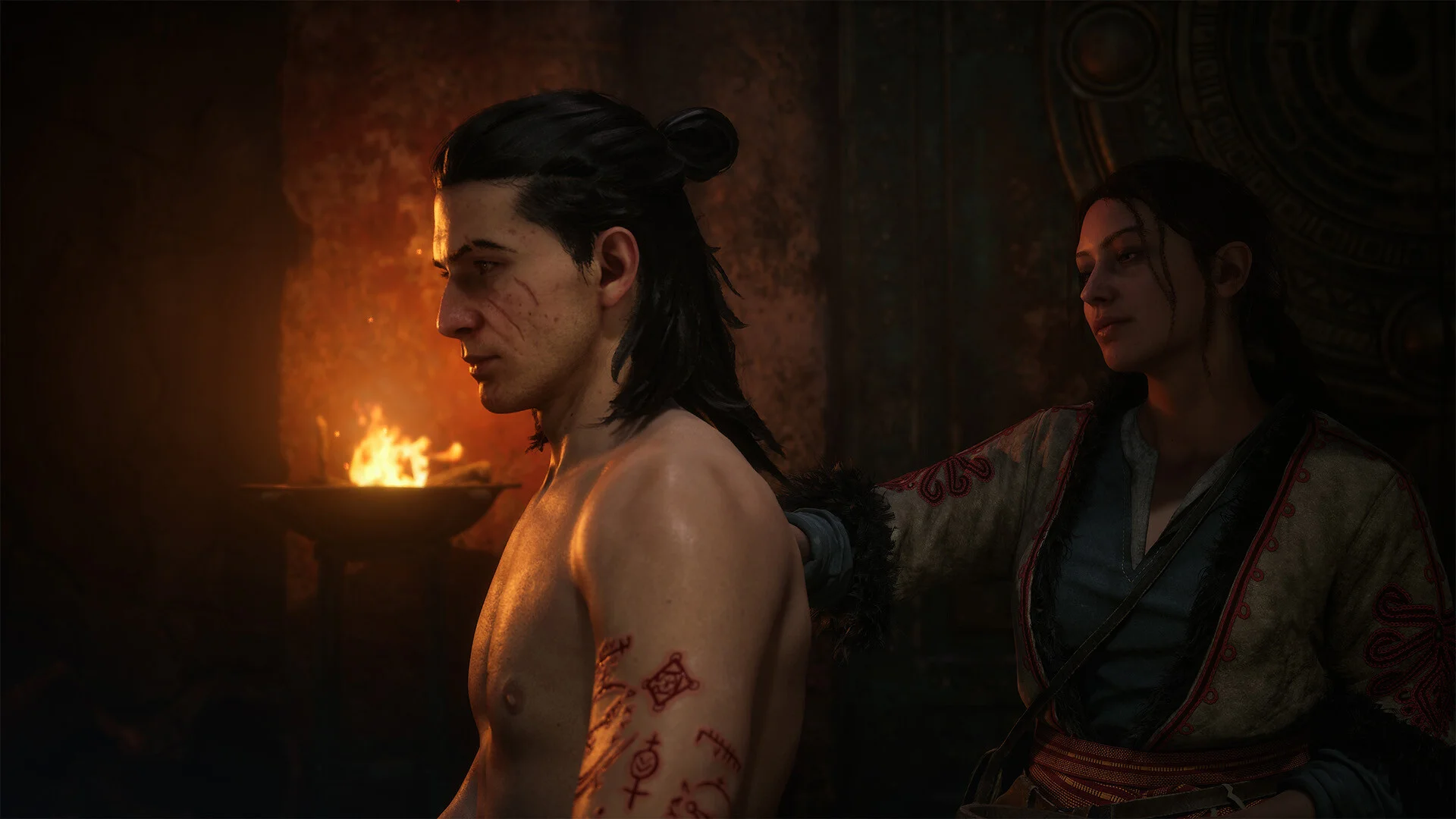 Red witchcraft runes cover Coen's arm while a woman stands behind him in The Blood of Dawnwalker.