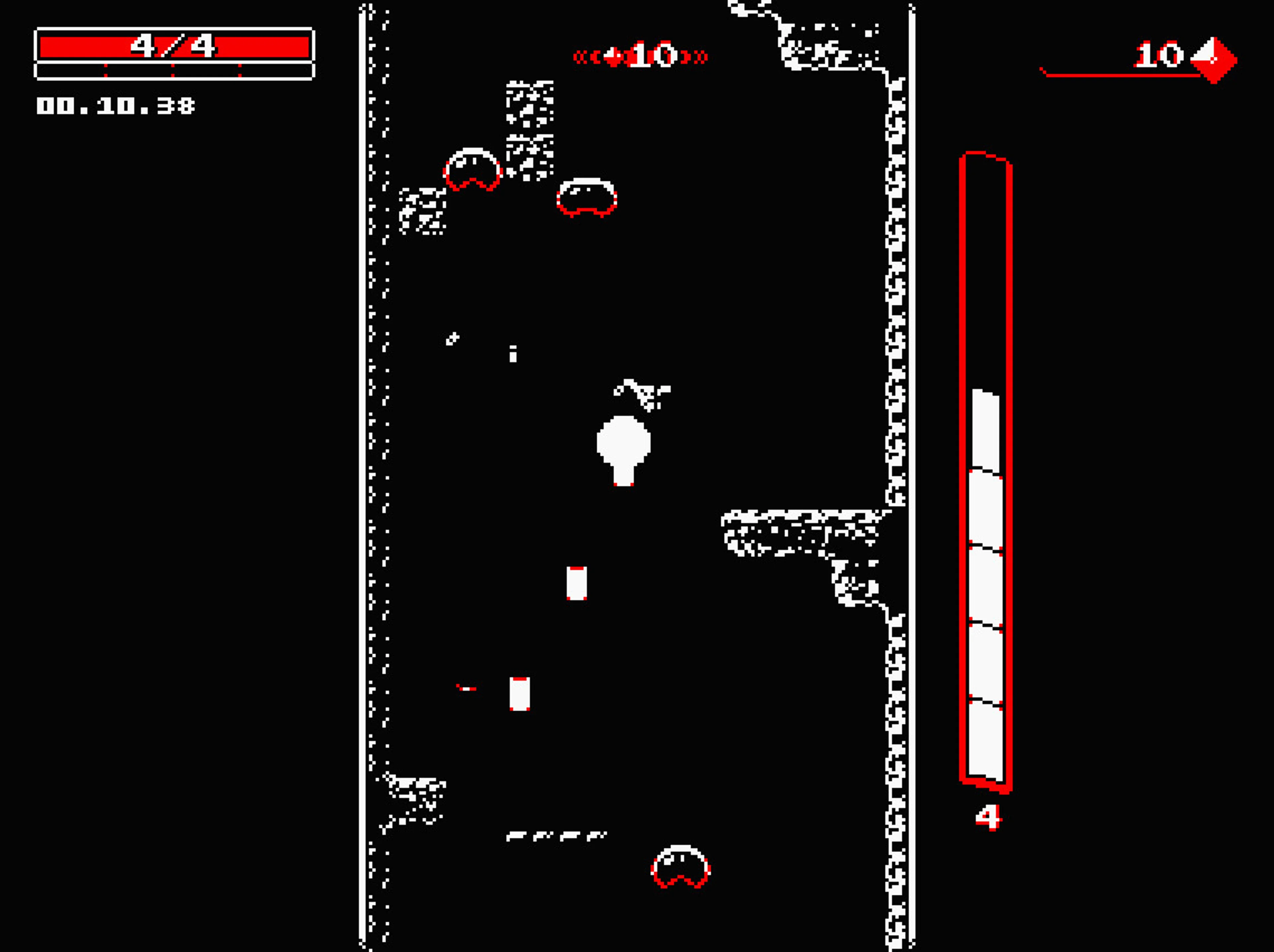 Downwell screenshot: the white character falls in the middle of a black shaft with several red-edged enemies above and below; health 4/4 is shown top left.
