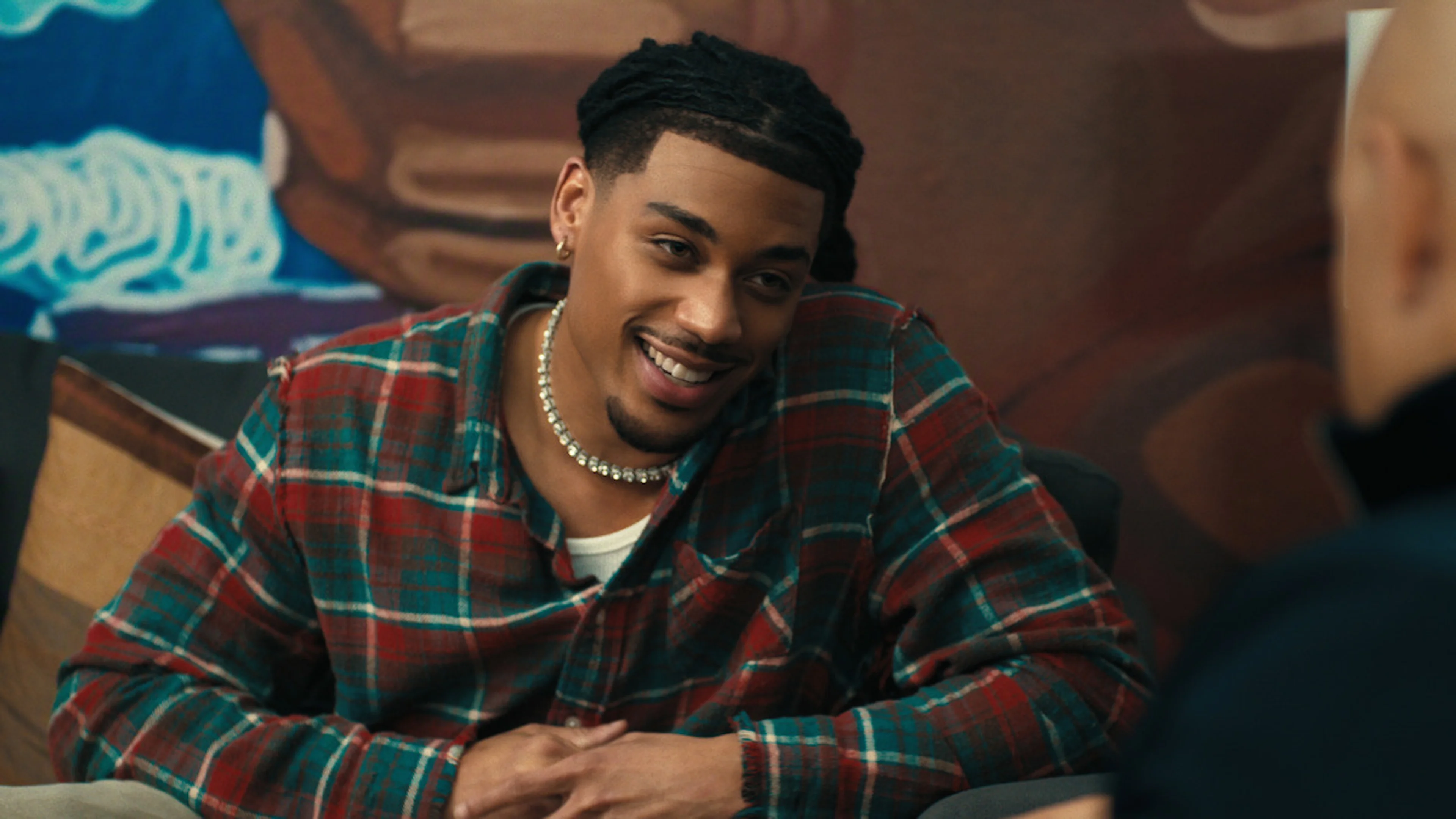Cornell Young IV in a plaid shirt during an interview.