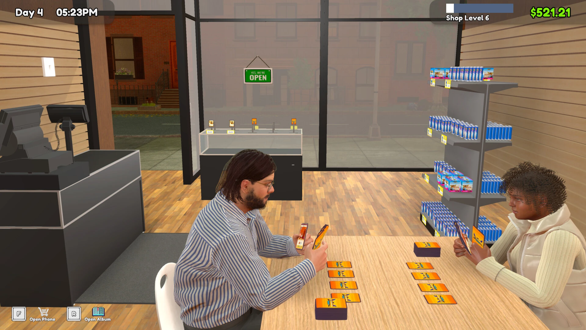 Customers playing cards at a table in TCG Card Shop Simulator.
