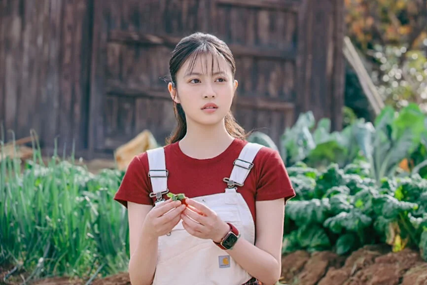 Mio Imada as Karin Shirahama standing on her strawberry farm.