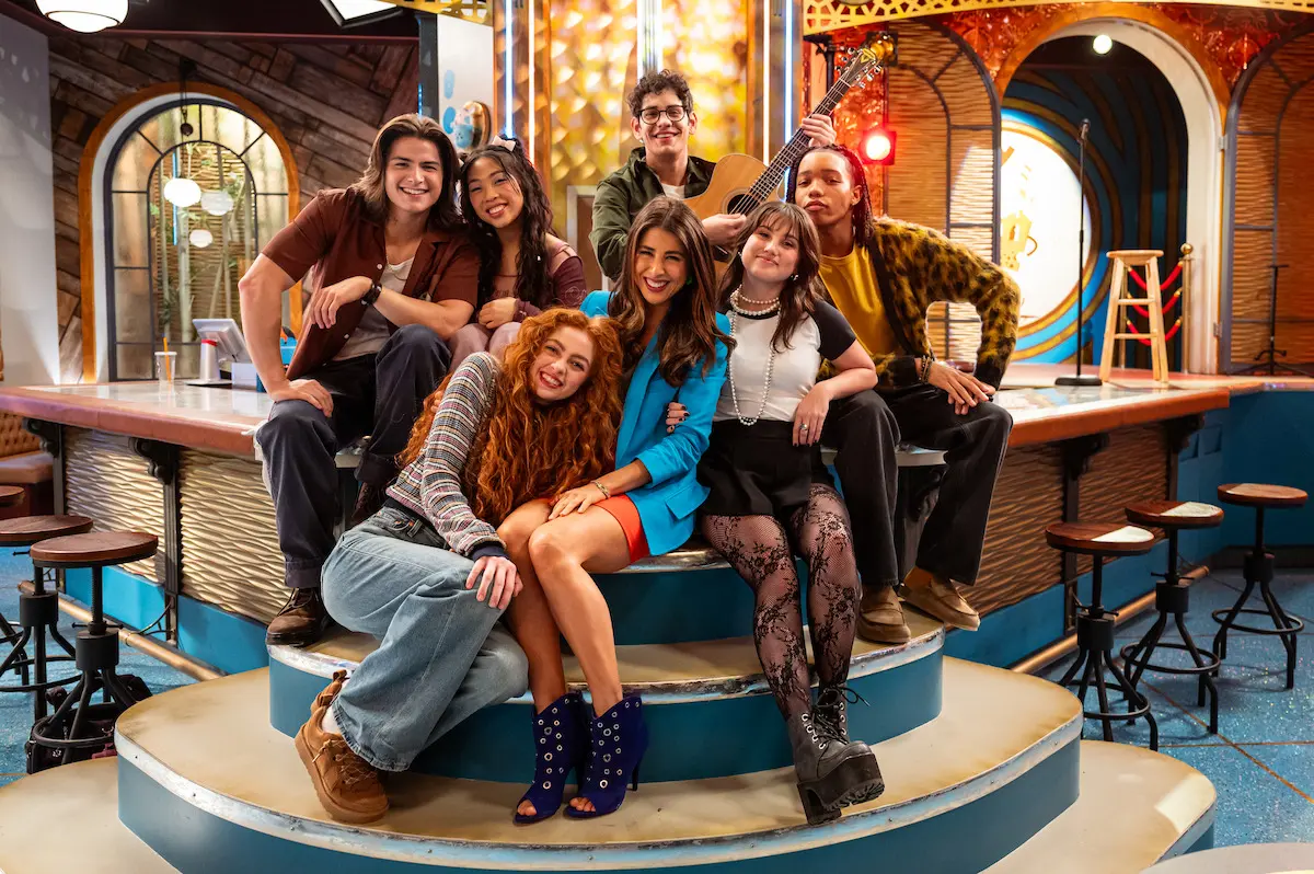 Daniella Monet as Trina Vega stands with the new Hollywood Arts student cast.