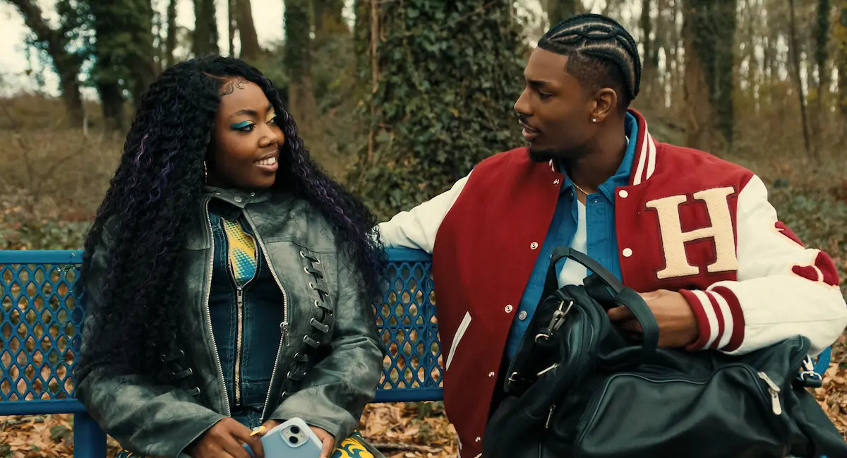 Deborah and Shaquille talk on a Hillman College bench in an official A Different World: The Legacy Continues still.