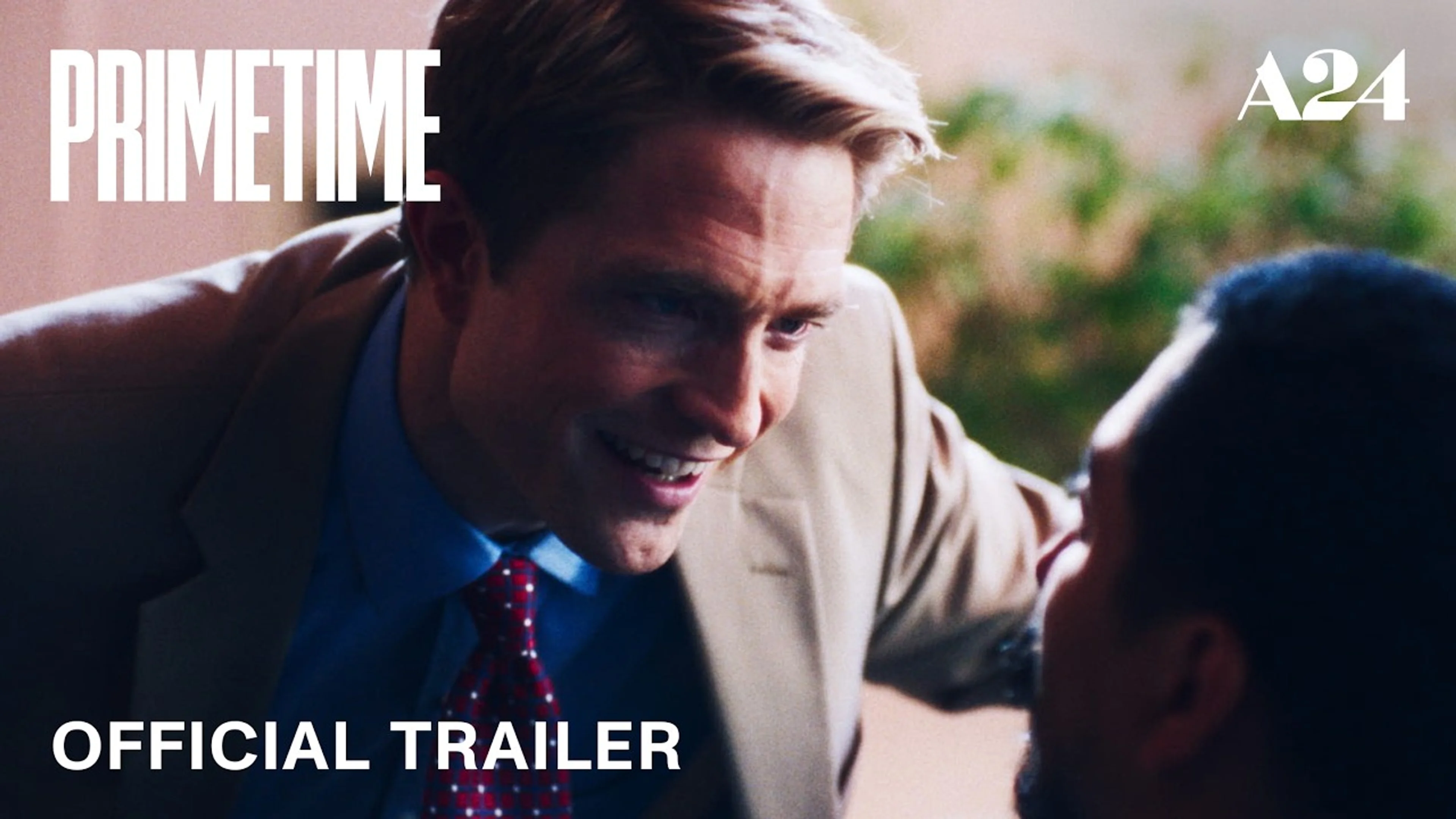 Robert Pattinson as Chris Hansen leans toward another man in A24’s Primetime trailer artwork.