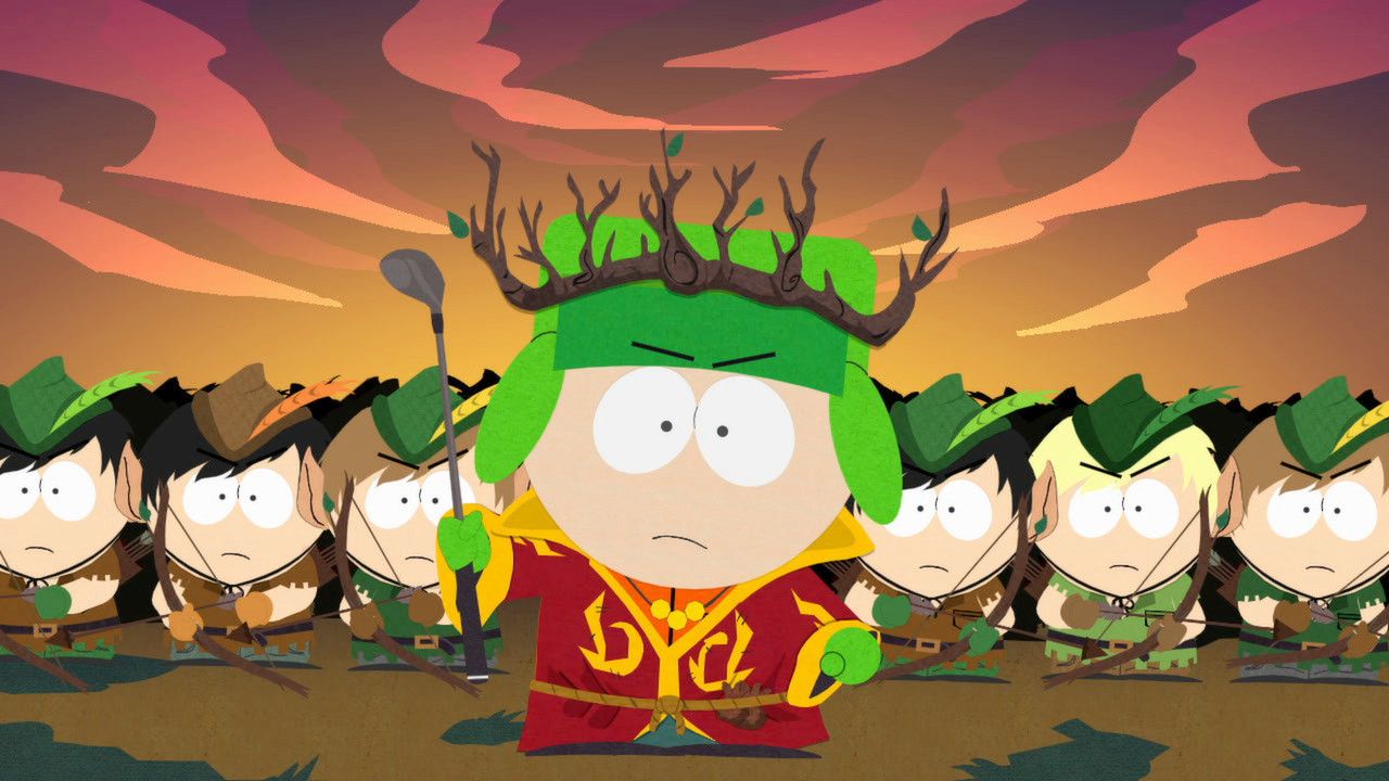 Kyle wears an elf costume and crown with other children lined up behind him.