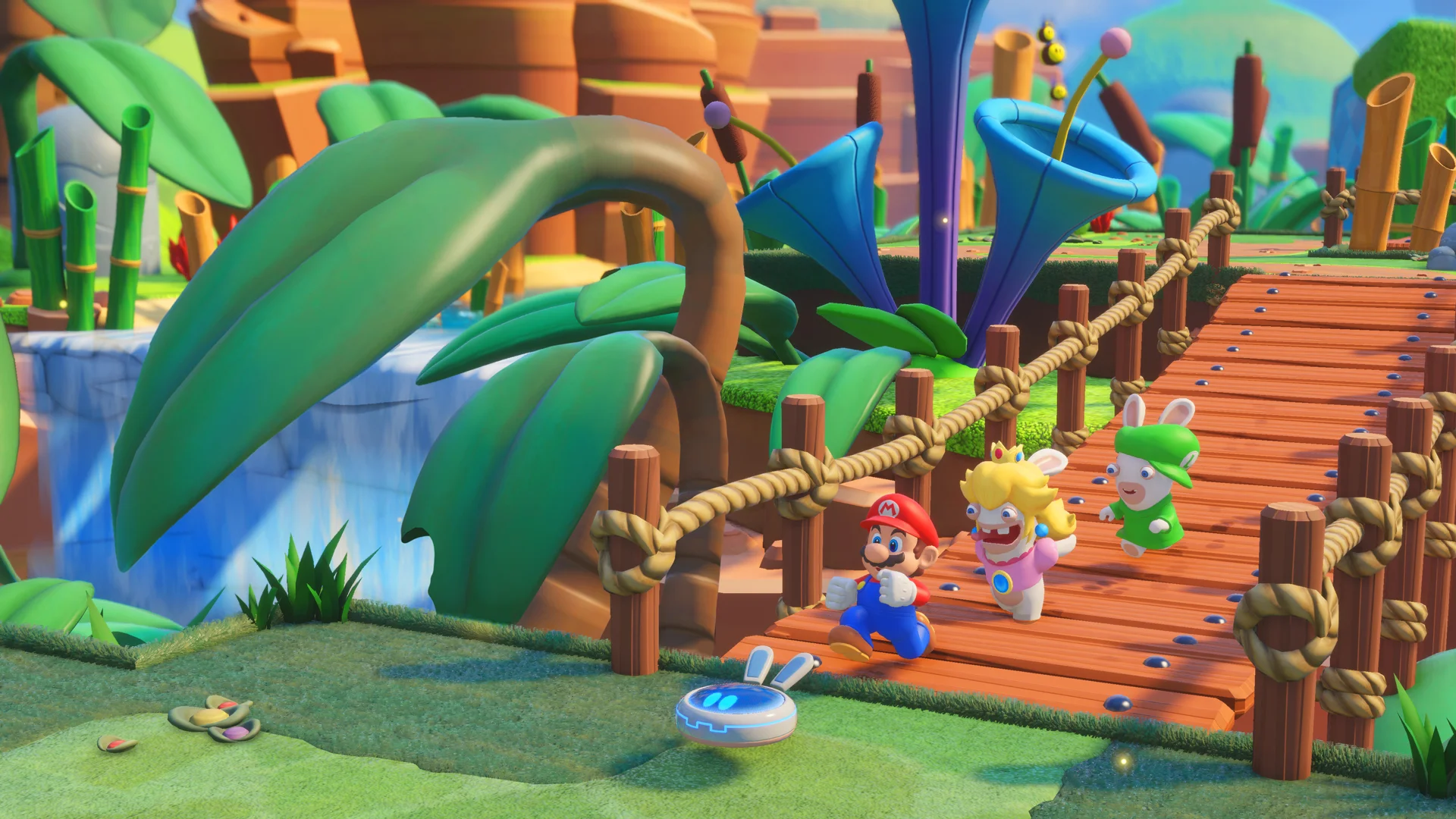 Mario and Rabbids walk along a bright outdoor path between turn-based fights.