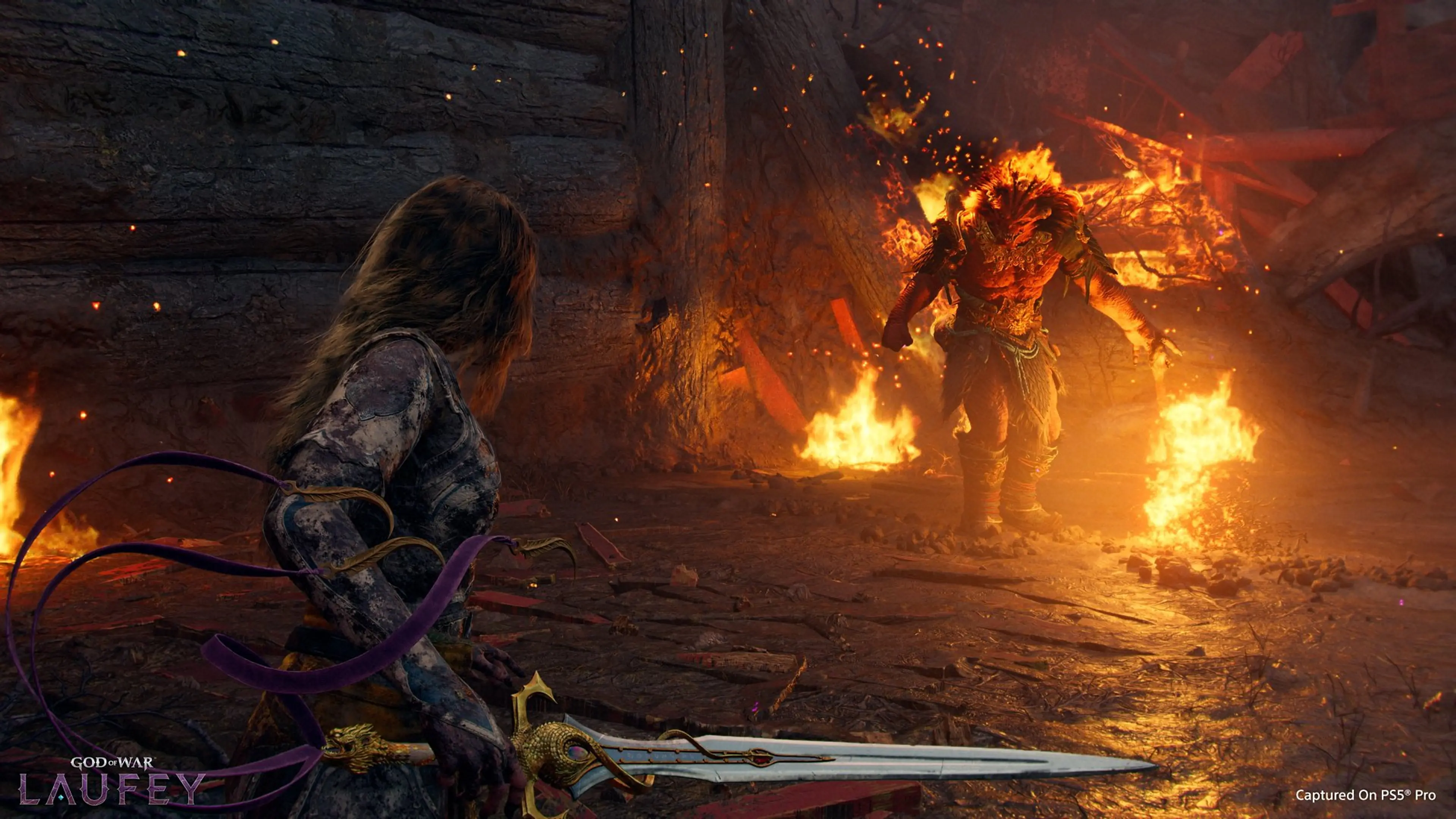 Gameplay screenshot: an armored archer confronts a fiery warrior in a burning chamber in God of War: Laufey.