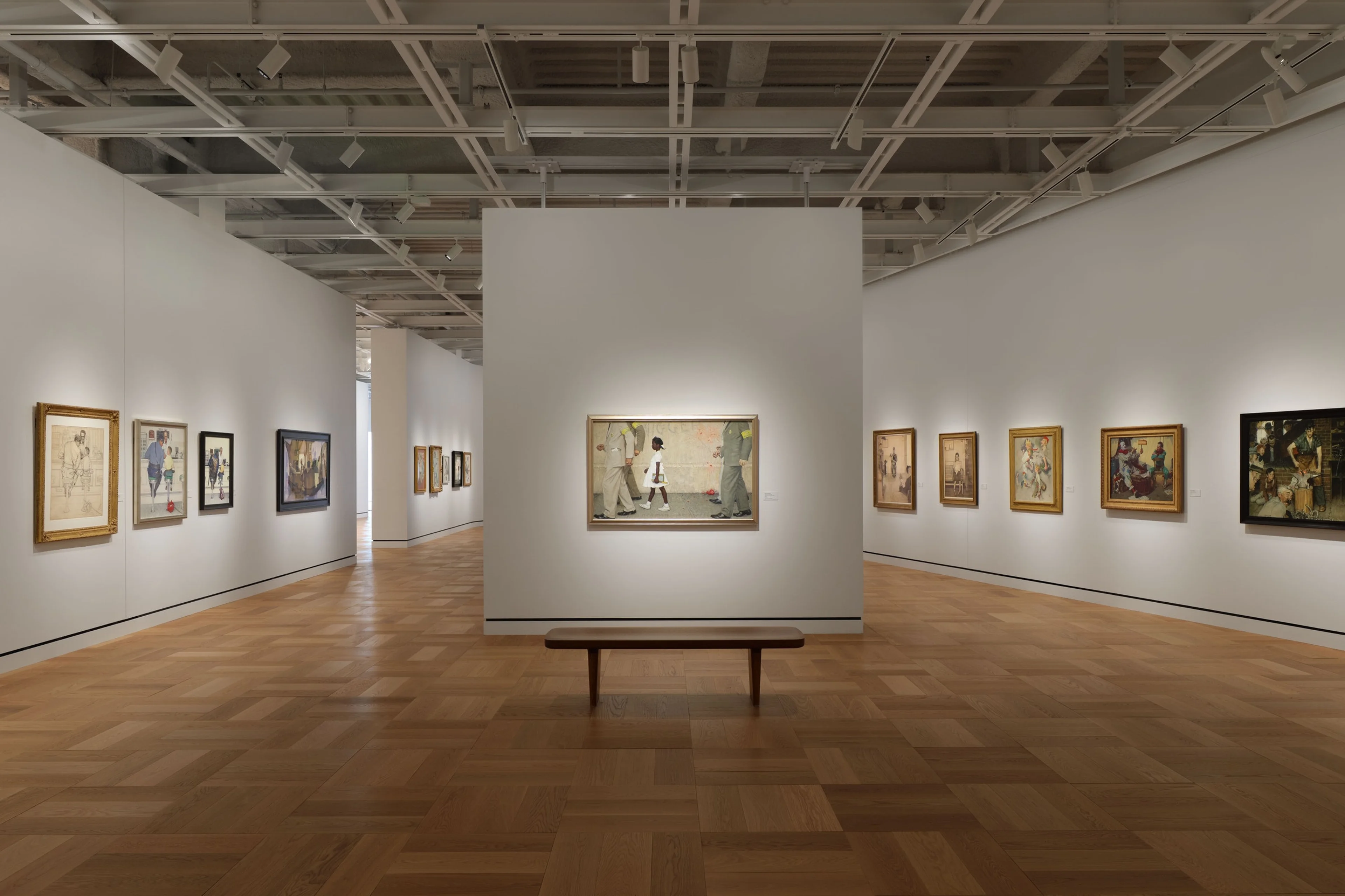 Framed paintings hang inside a gallery at the Lucas Museum of Narrative Art.