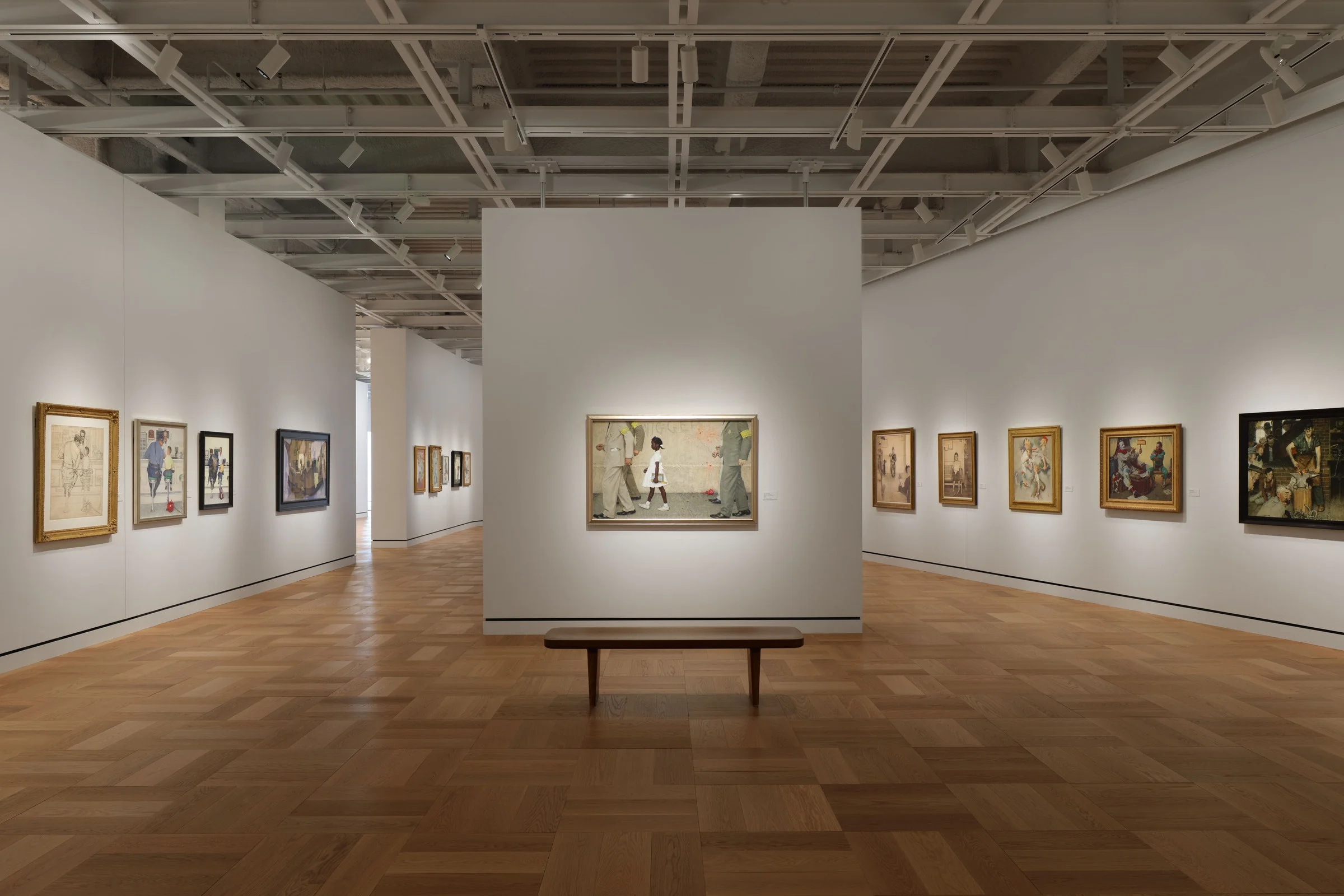 Framed paintings hang inside a gallery at the Lucas Museum of Narrative Art.