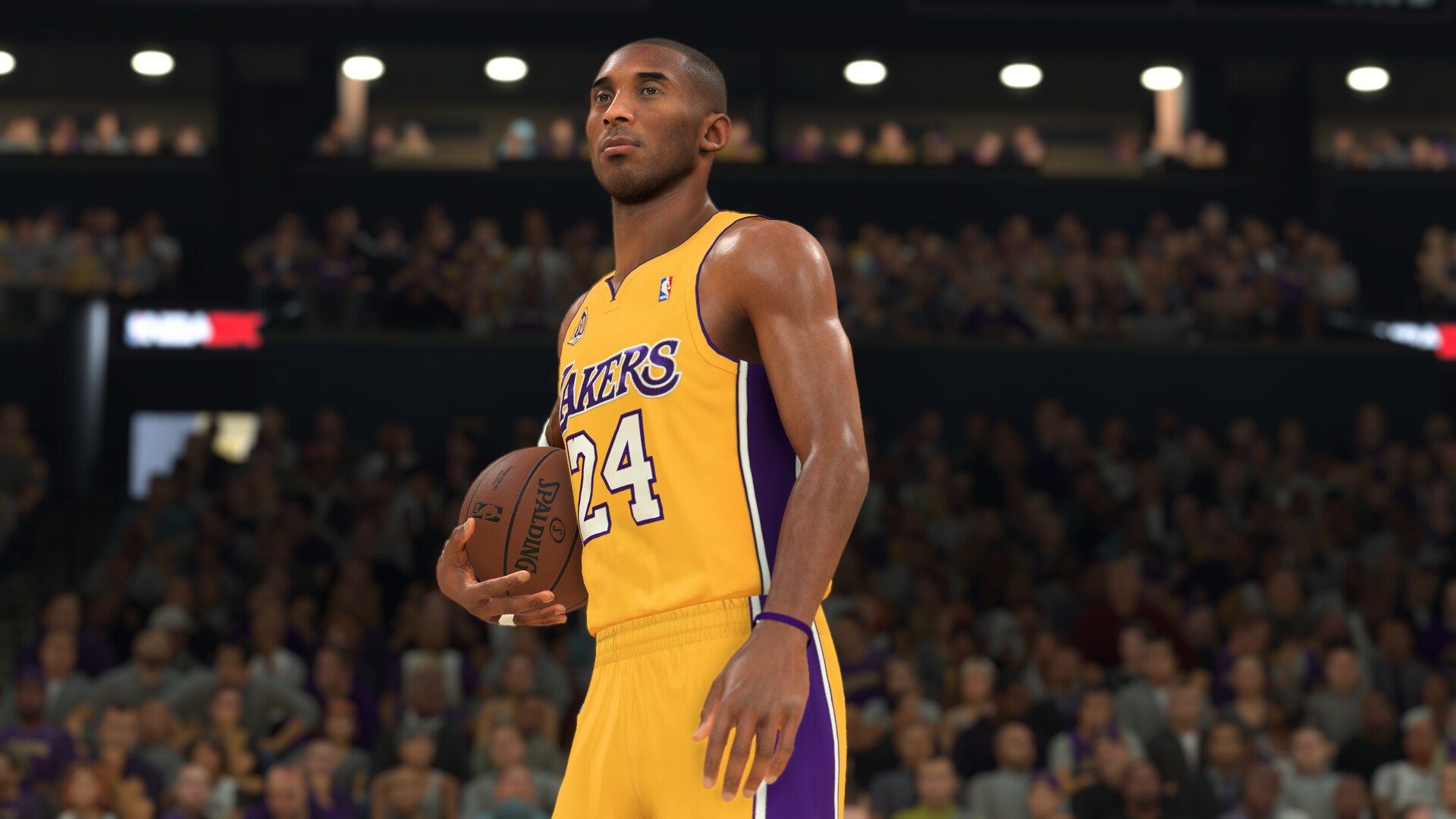 Kobe Bryant in a Lakers uniform holding a basketball in NBA 2K24.