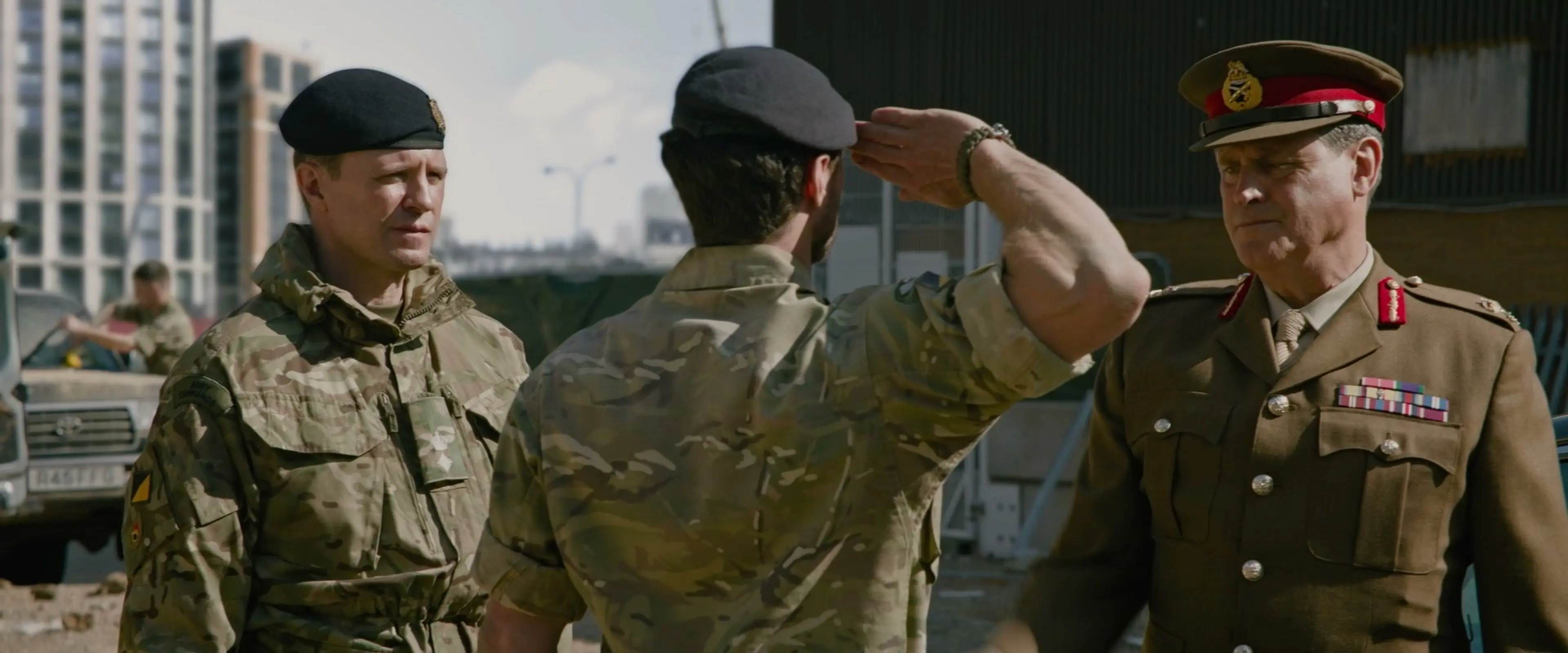 Will Tranter salutes two officers at the building site.