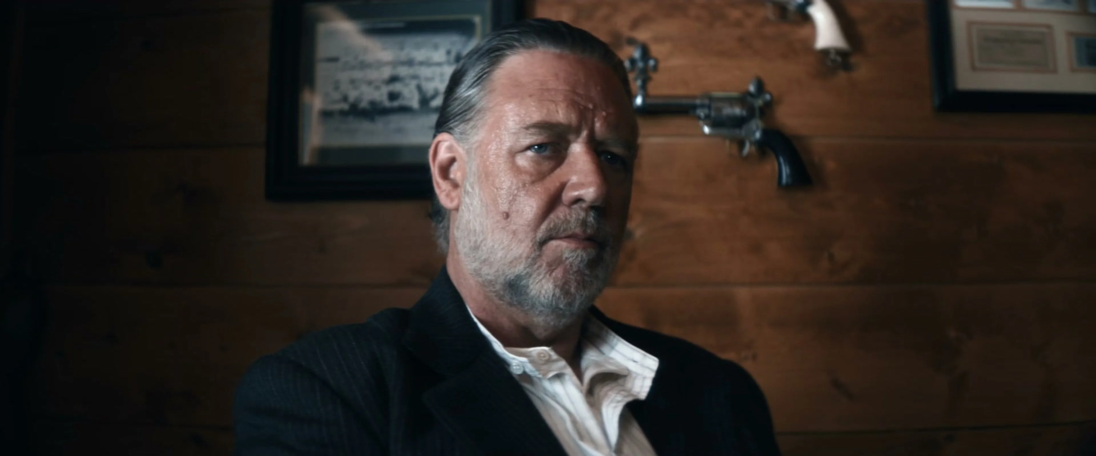 Russell Crowe appears as prison warden Clancy in The Weight.