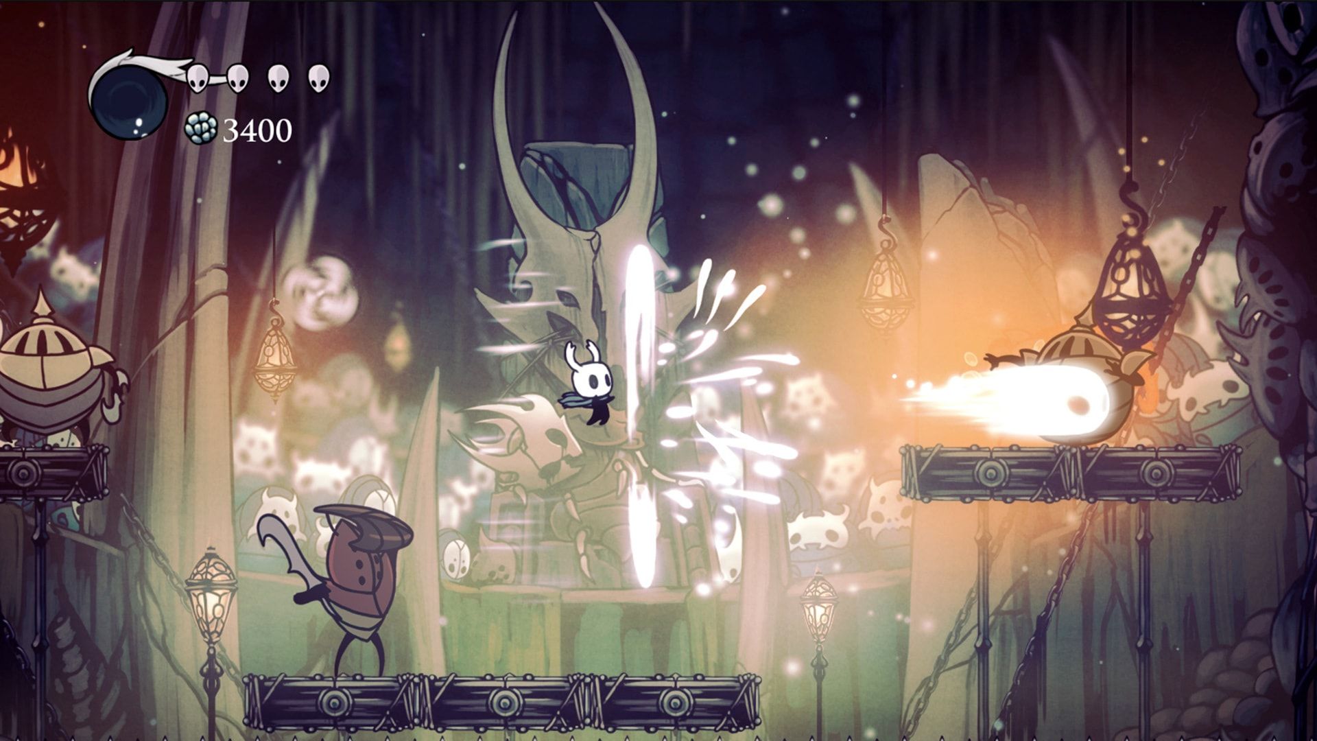 The Knight jumps through a glowing cavern with enemies nearby.