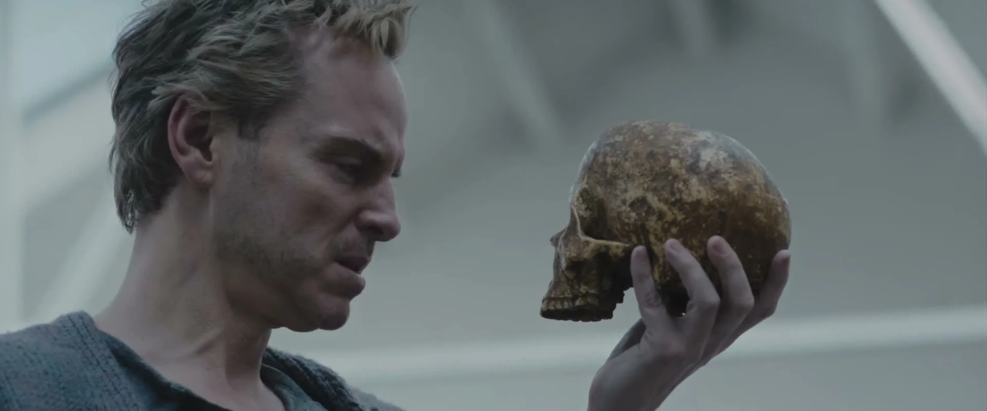 Andrew Scott as Ian Charleson holds a skull in a frame from the official Elsinore trailer.