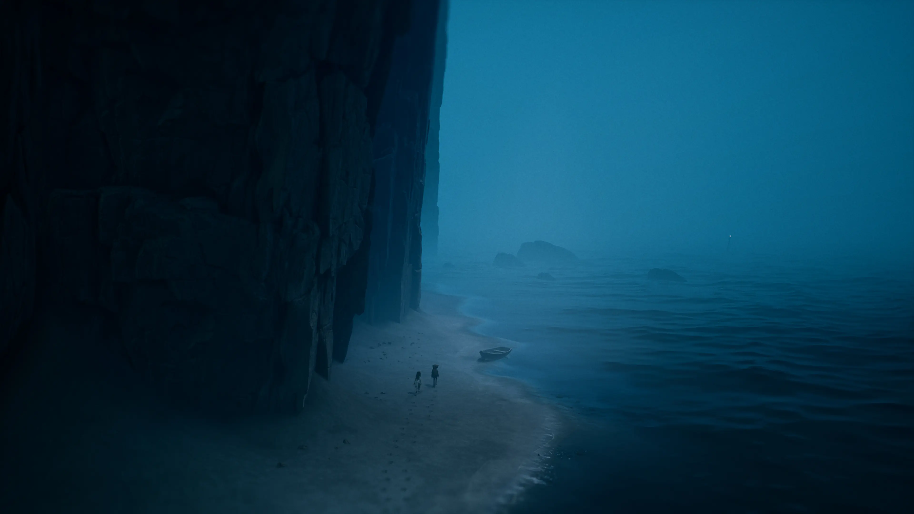 Two characters walk along a misty shore beneath a towering cliff.