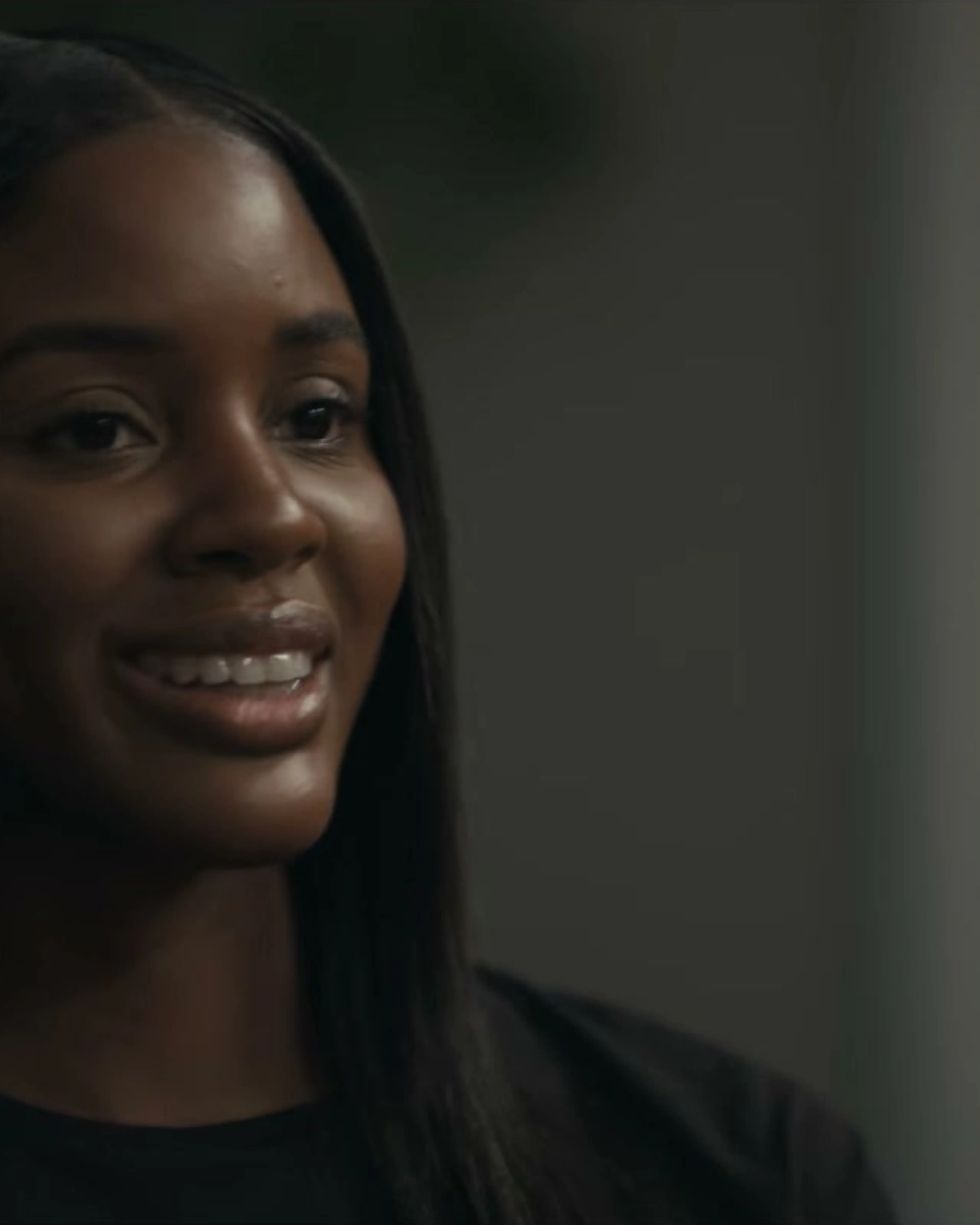 Naomi Baker looks toward someone during a conversation in Doing Life.
