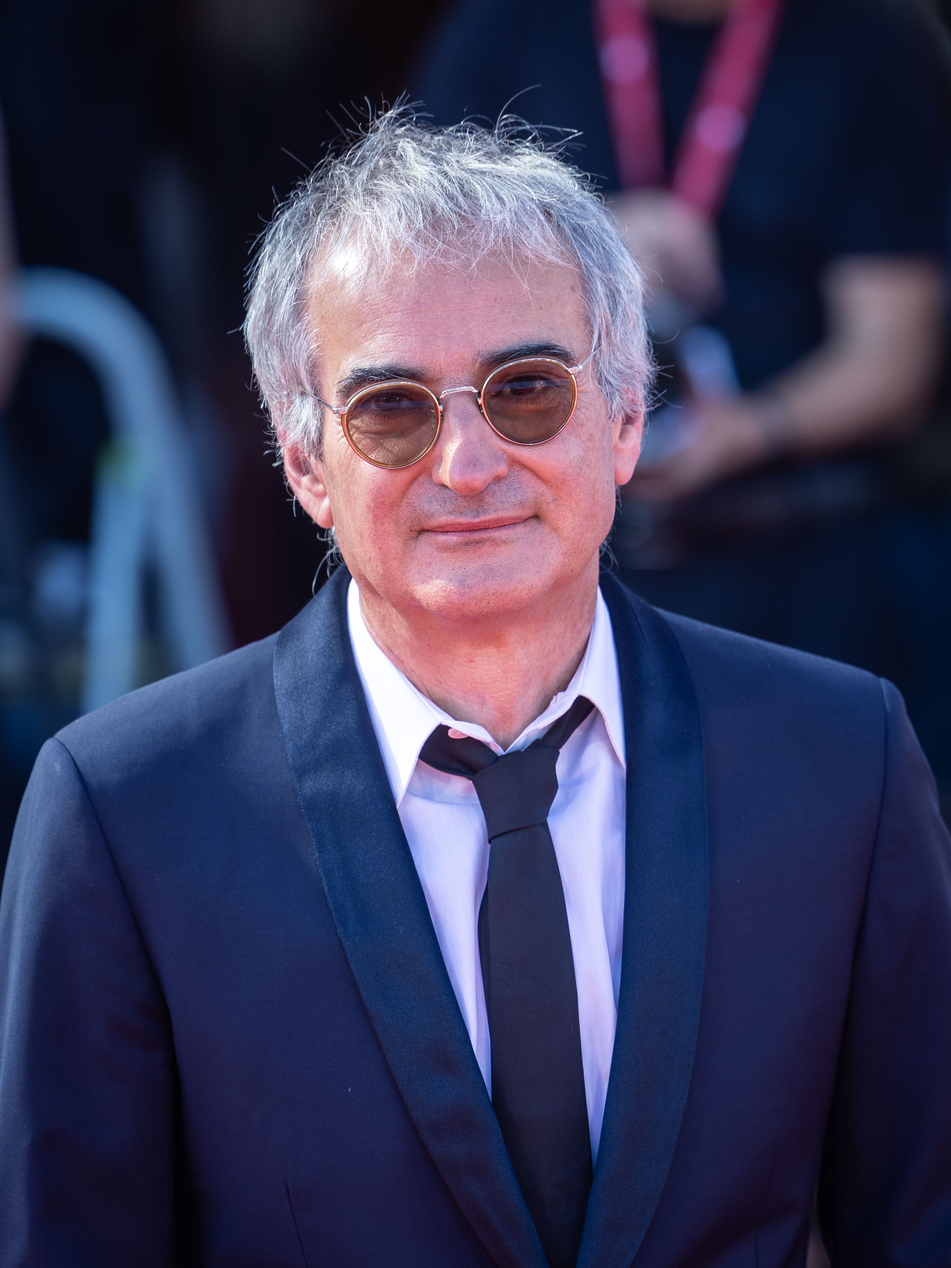 Director Olivier Assayas poses at a 2025 film event.