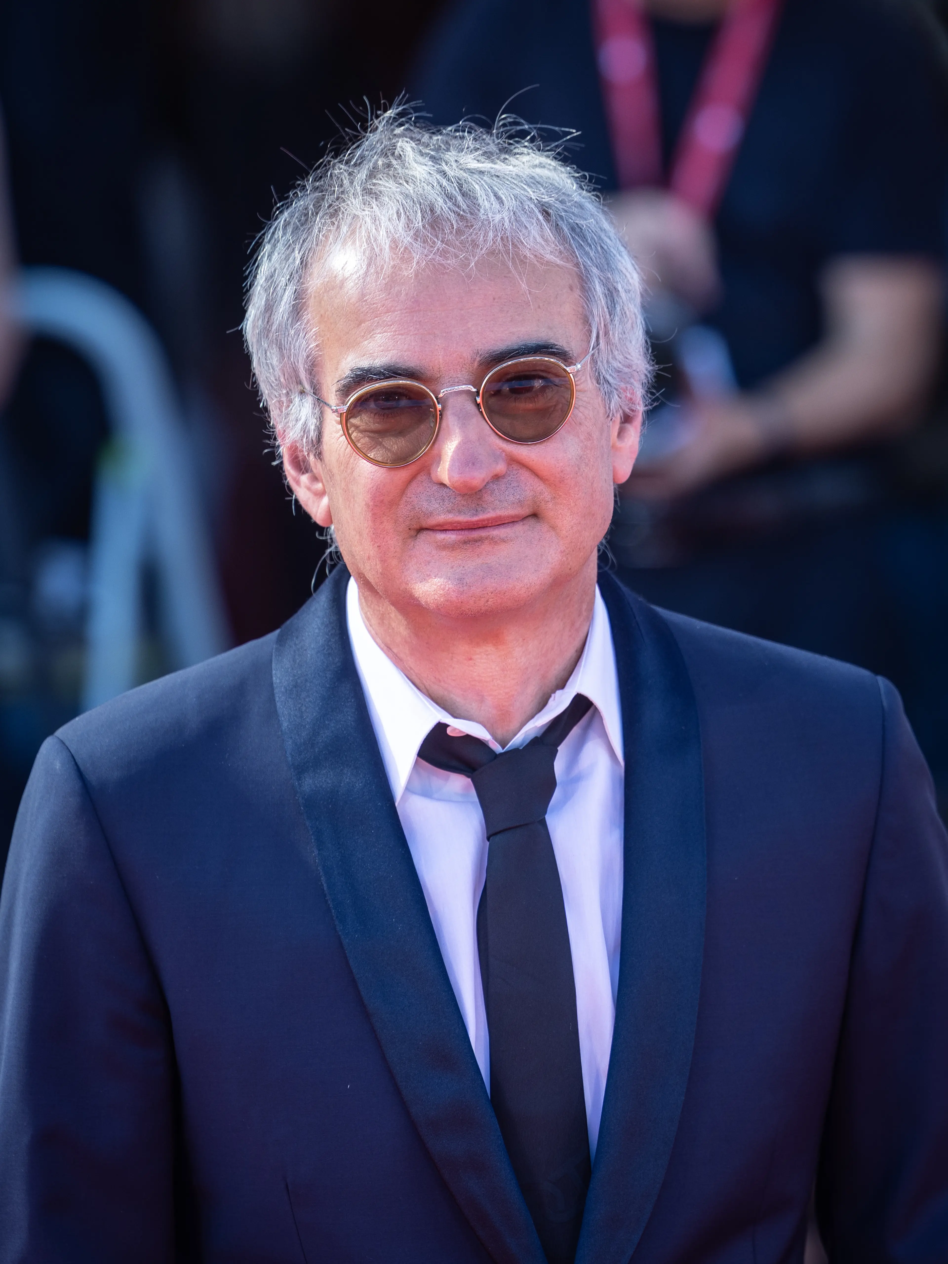 Director Olivier Assayas poses at a 2025 film event.