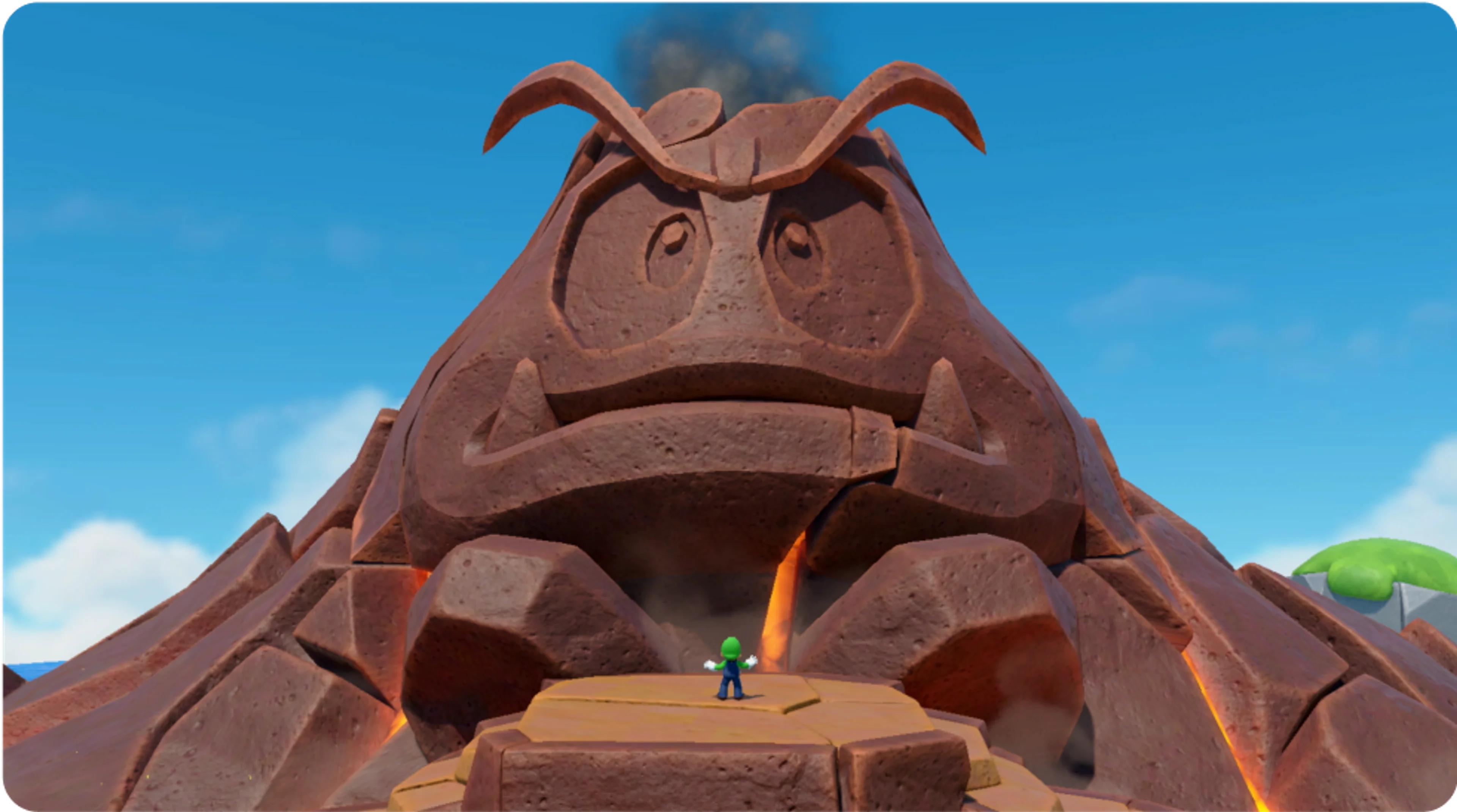 A Goomba-shaped mountain rises over a Mario Party Jamboree board.