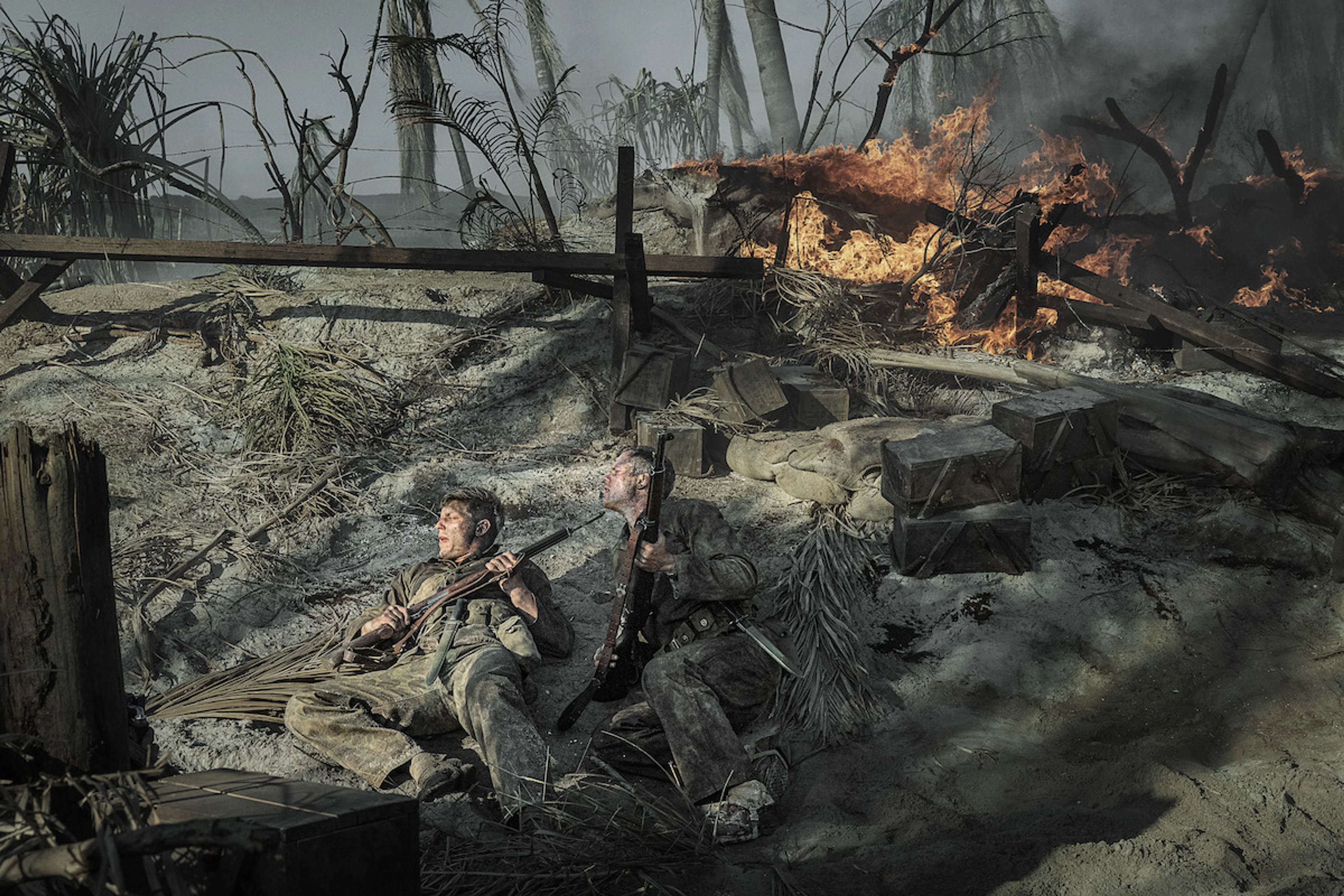 Tom Francis as David Schreiner and Bill Skarsgård as Bob Baumann take cover during combat in The Mosquito Bowl.