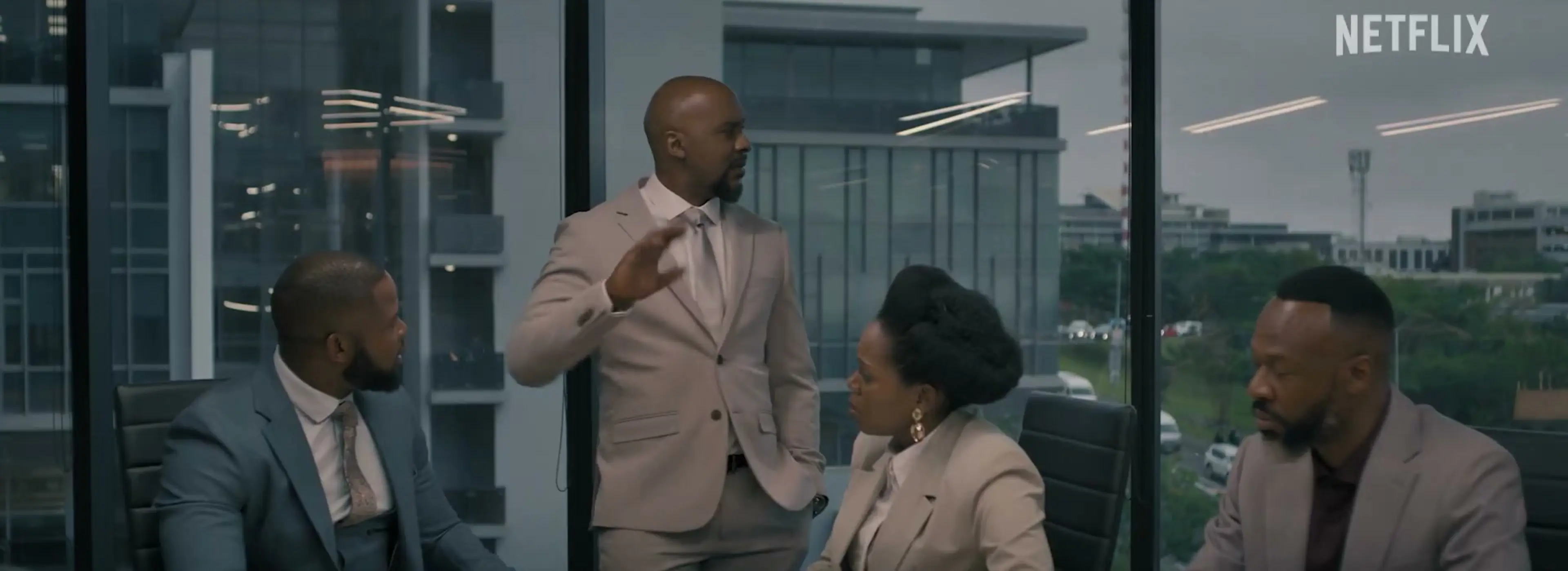 Four people argue around a boardroom table in Blood Legacy season 2.