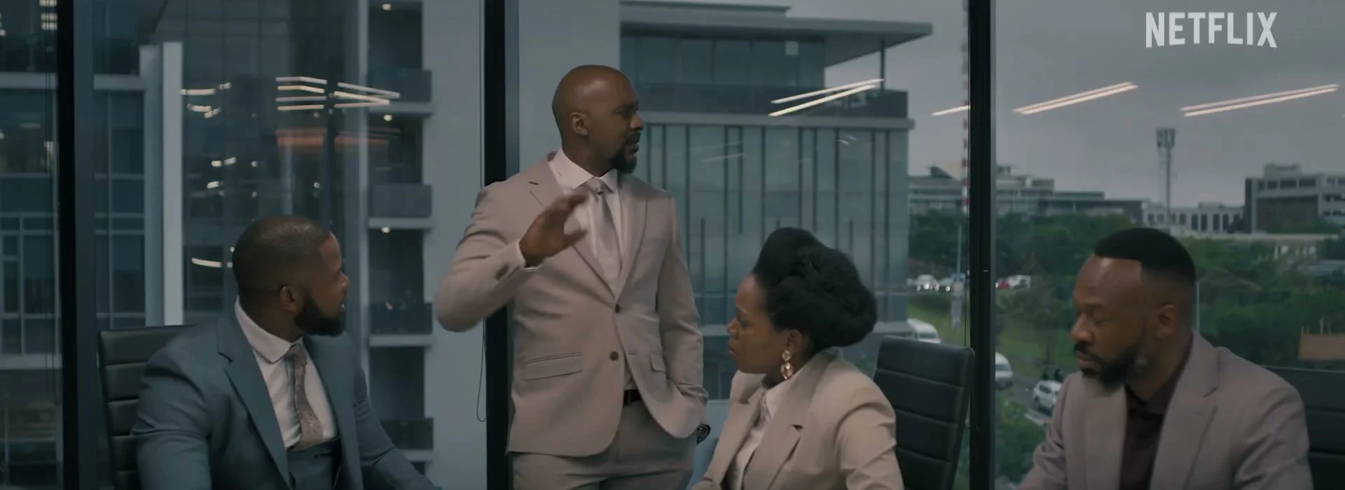 Four people argue around a boardroom table in Blood Legacy season 2.