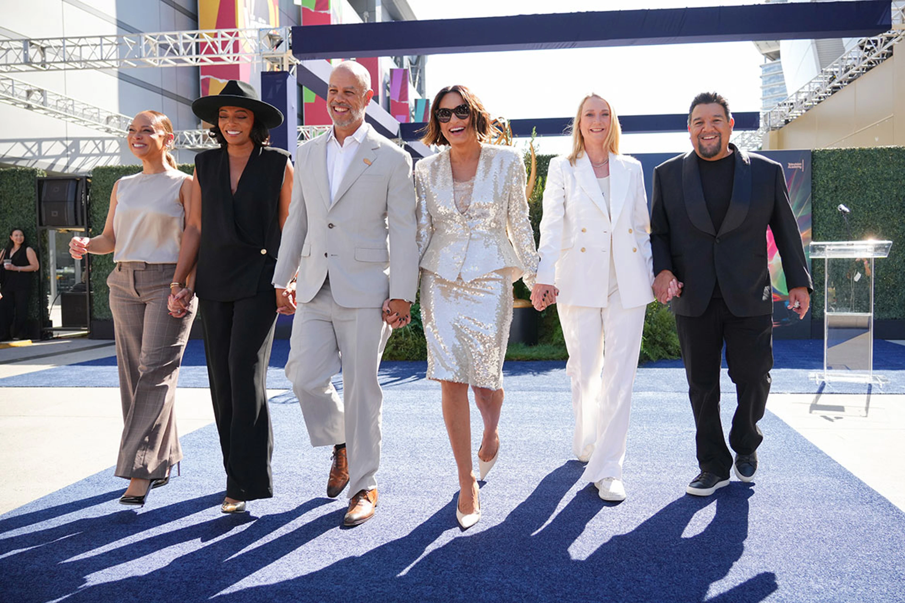 Mariska Hargitay walks the blue carpet with the 78th Emmy Awards production team at the official press preview.