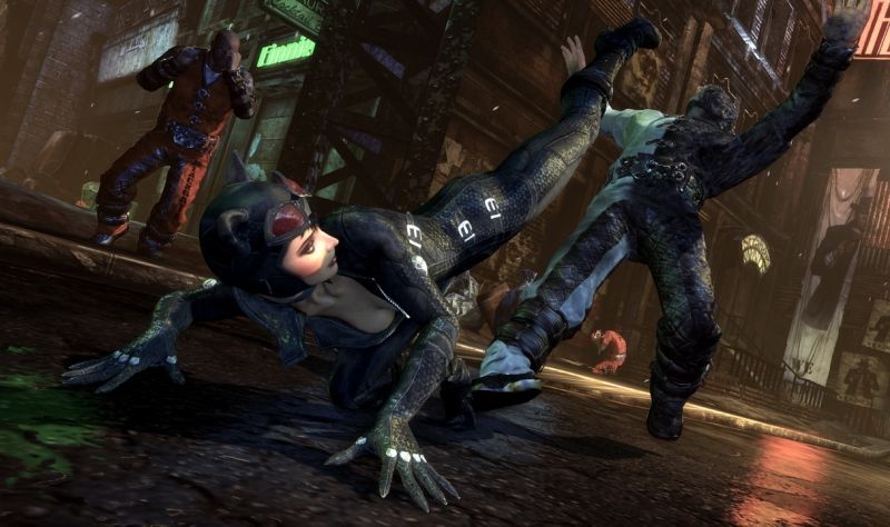 Catwoman, in a black catsuit and red-lensed goggles, slides into a fight.