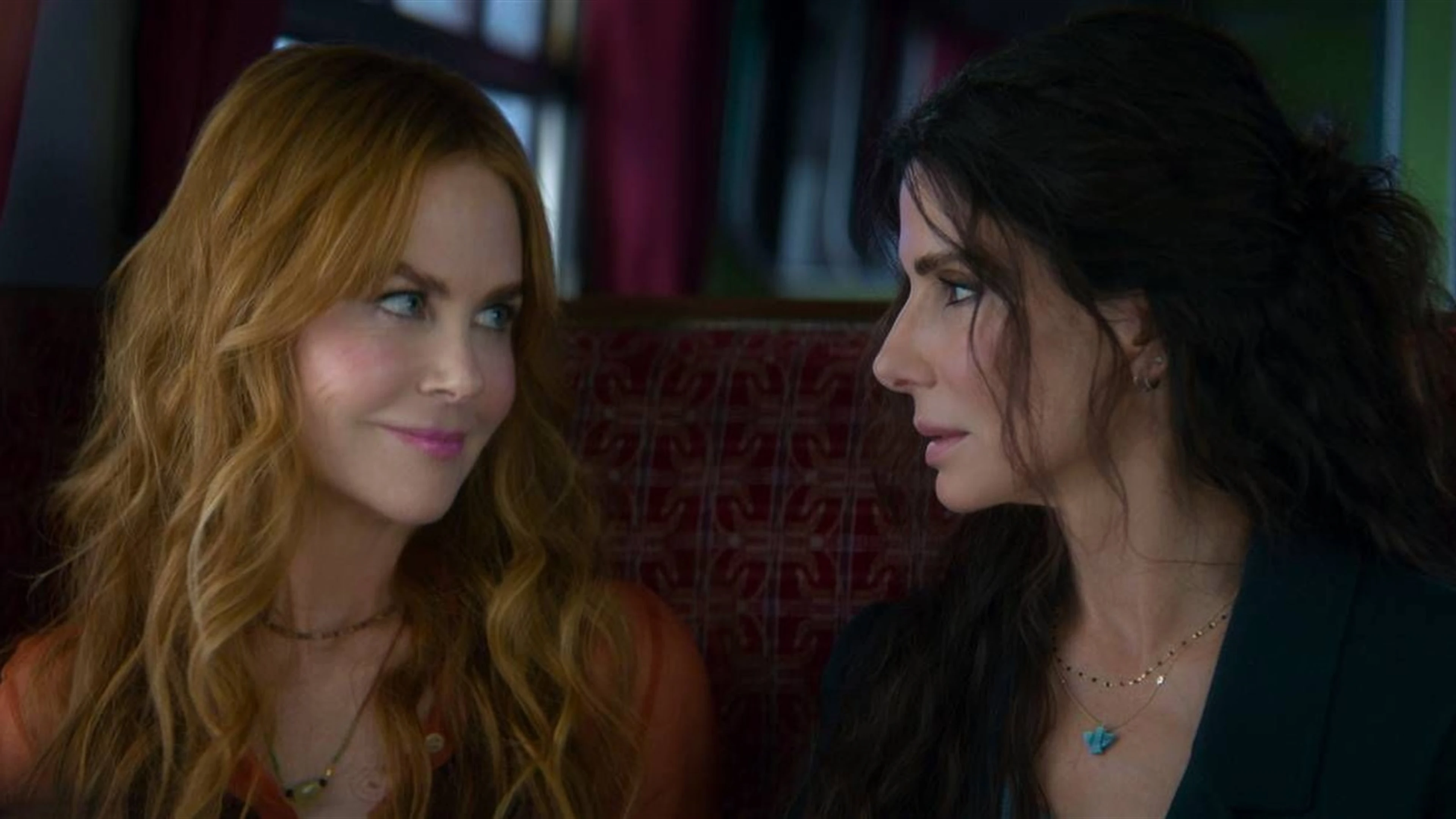 Nicole Kidman as Gillian Owens looks toward Sandra Bullock as Sally Owens in Practical Magic 2.