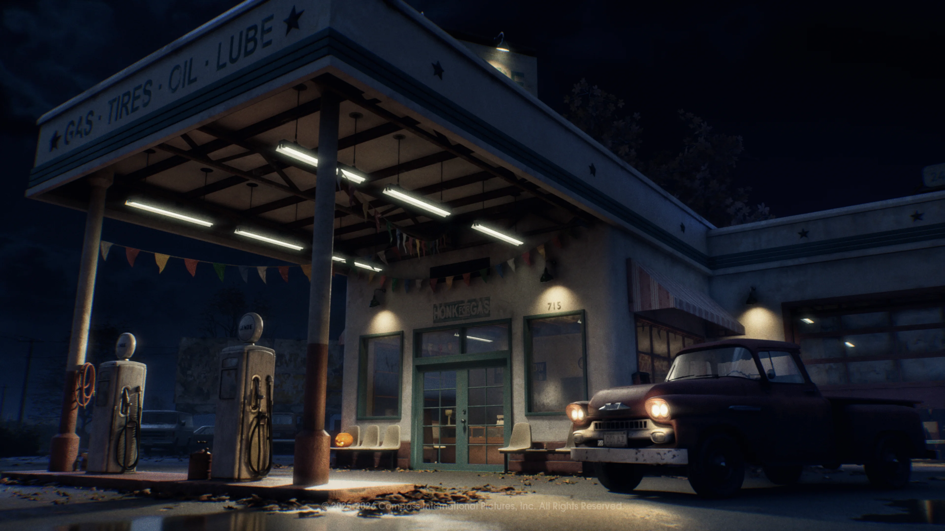 Phelps Garage glows beside an old pickup truck on a dark East Haddonfield road.