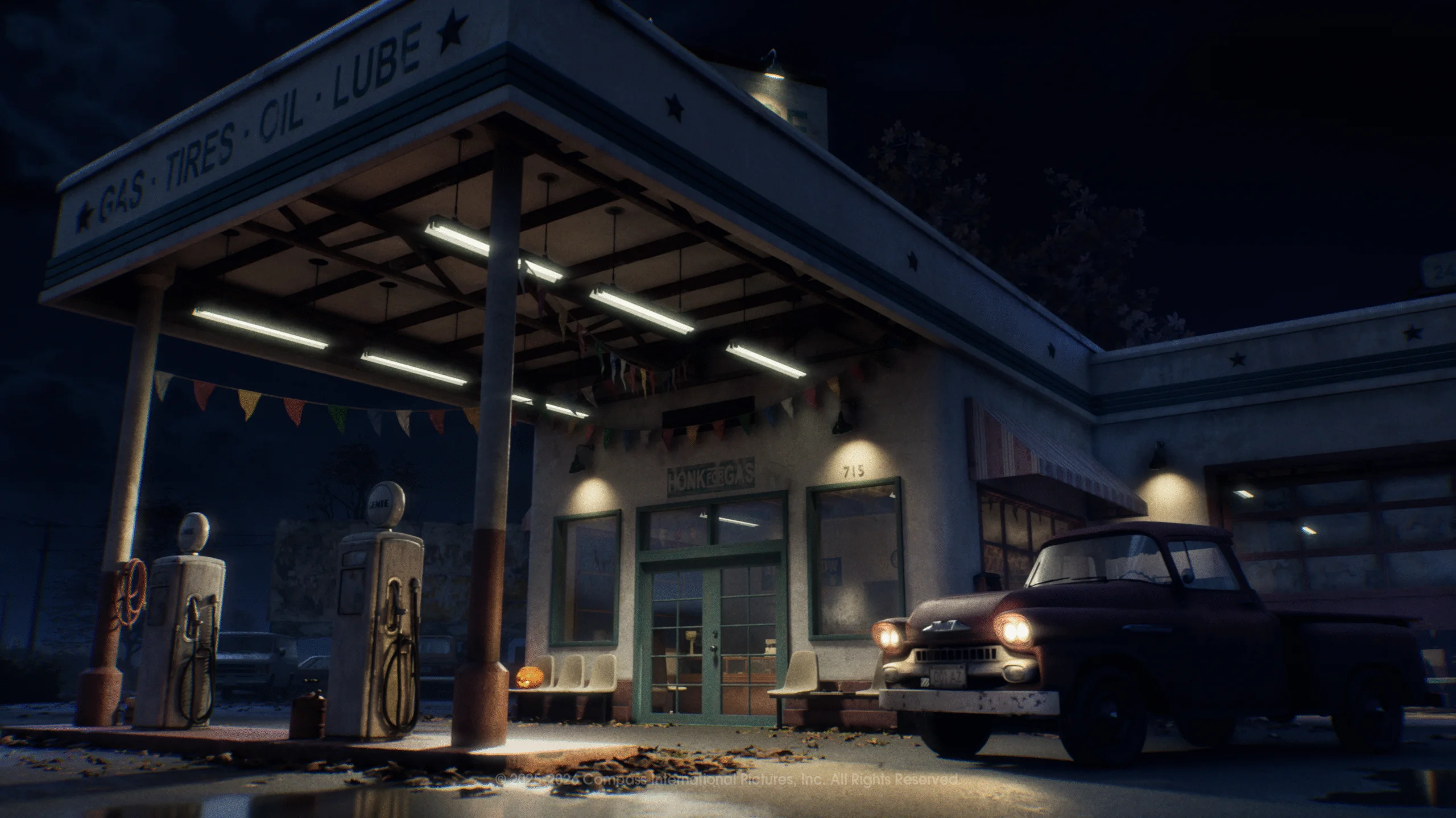 Phelps Garage glows beside an old pickup truck on a dark East Haddonfield road.