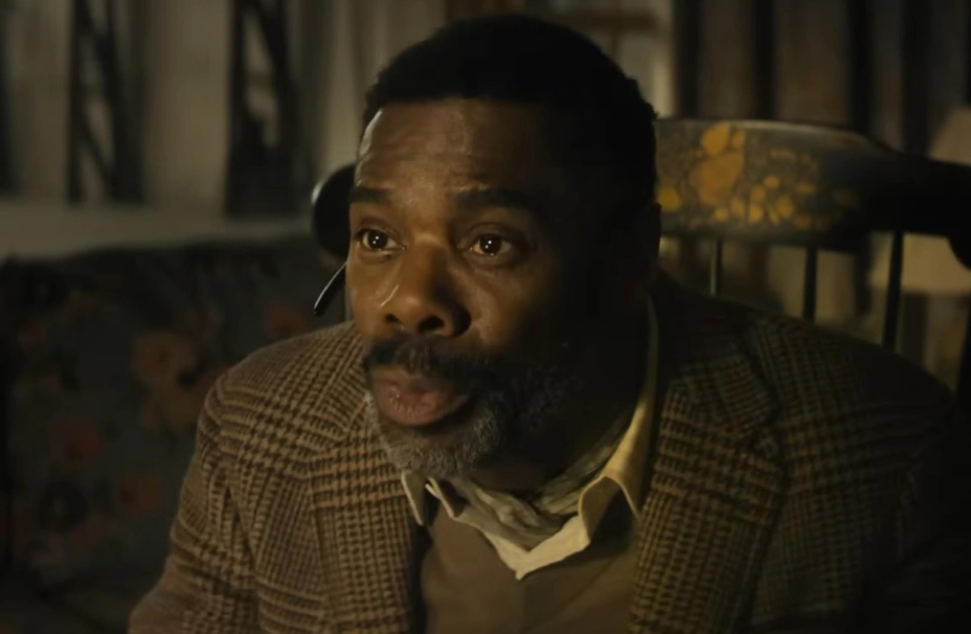 Colman Domingo as Hugo Wakefield sits wearing a headset.