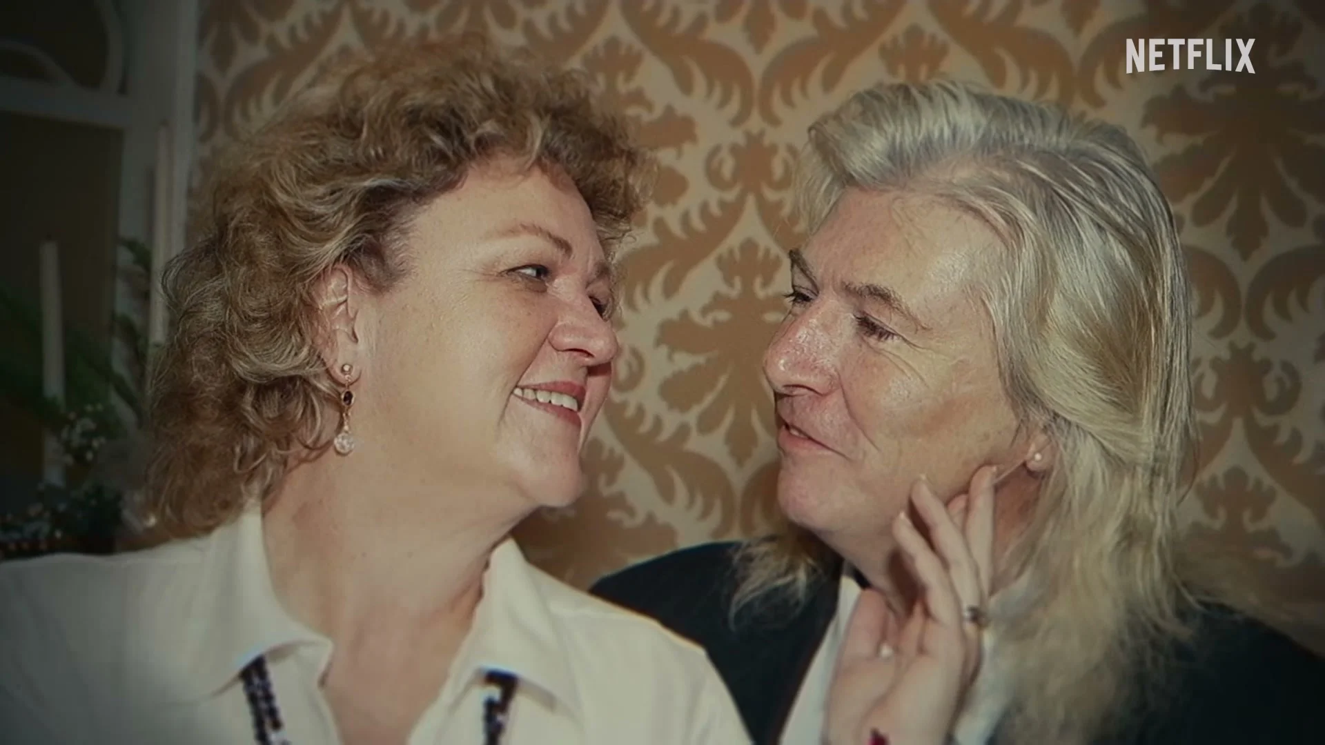 A man and woman look at each other in an archival photograph shown in The Widower: ’Til Death Do Us Part.