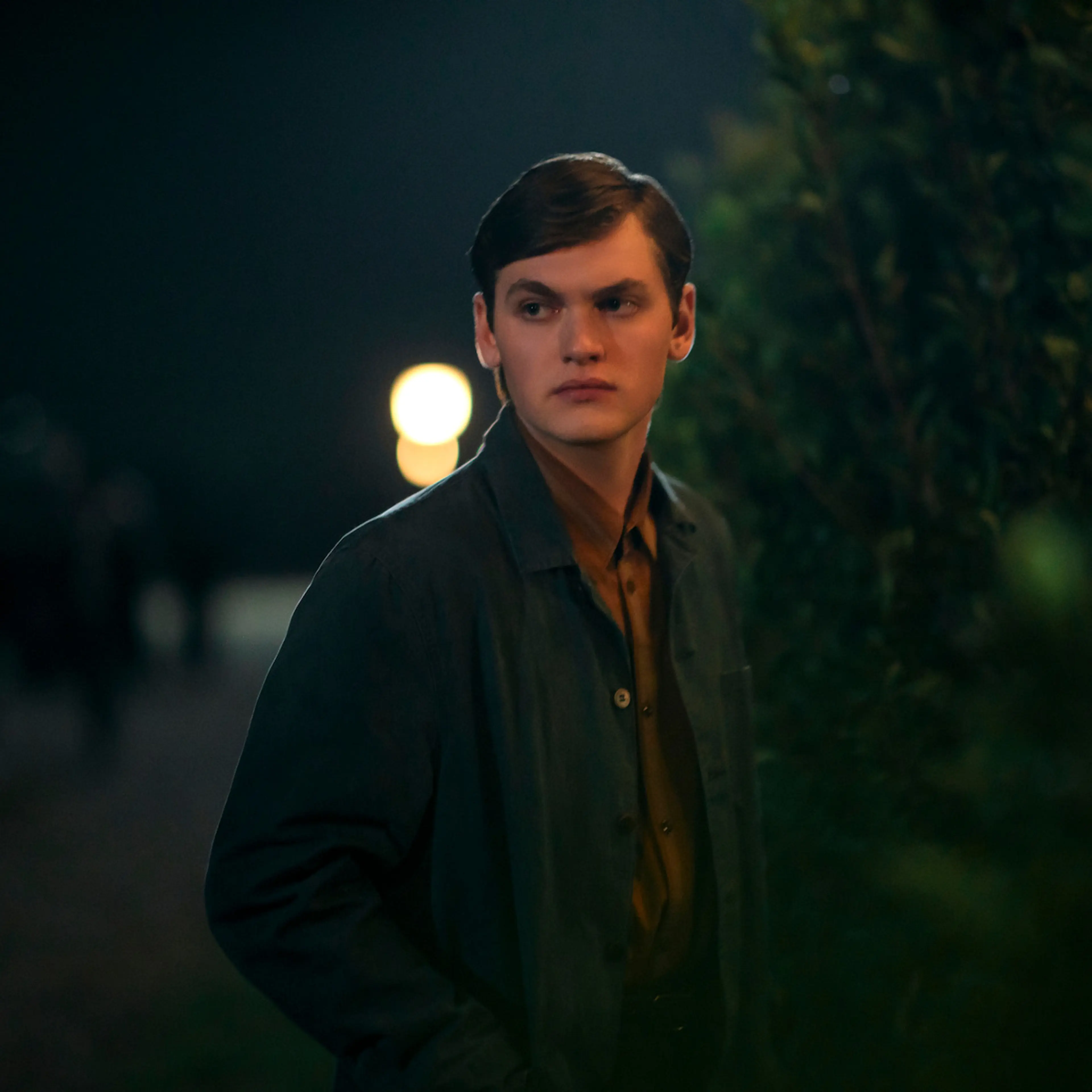 Joe Anders as Aron Trask, wearing a dark jacket outdoors in East of Eden.