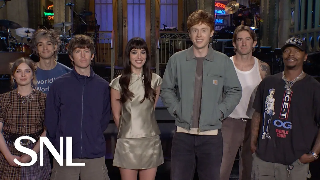 Dakota Johnson and Ben Marshall stand with Turnstile on the SNL stage in the official promo.