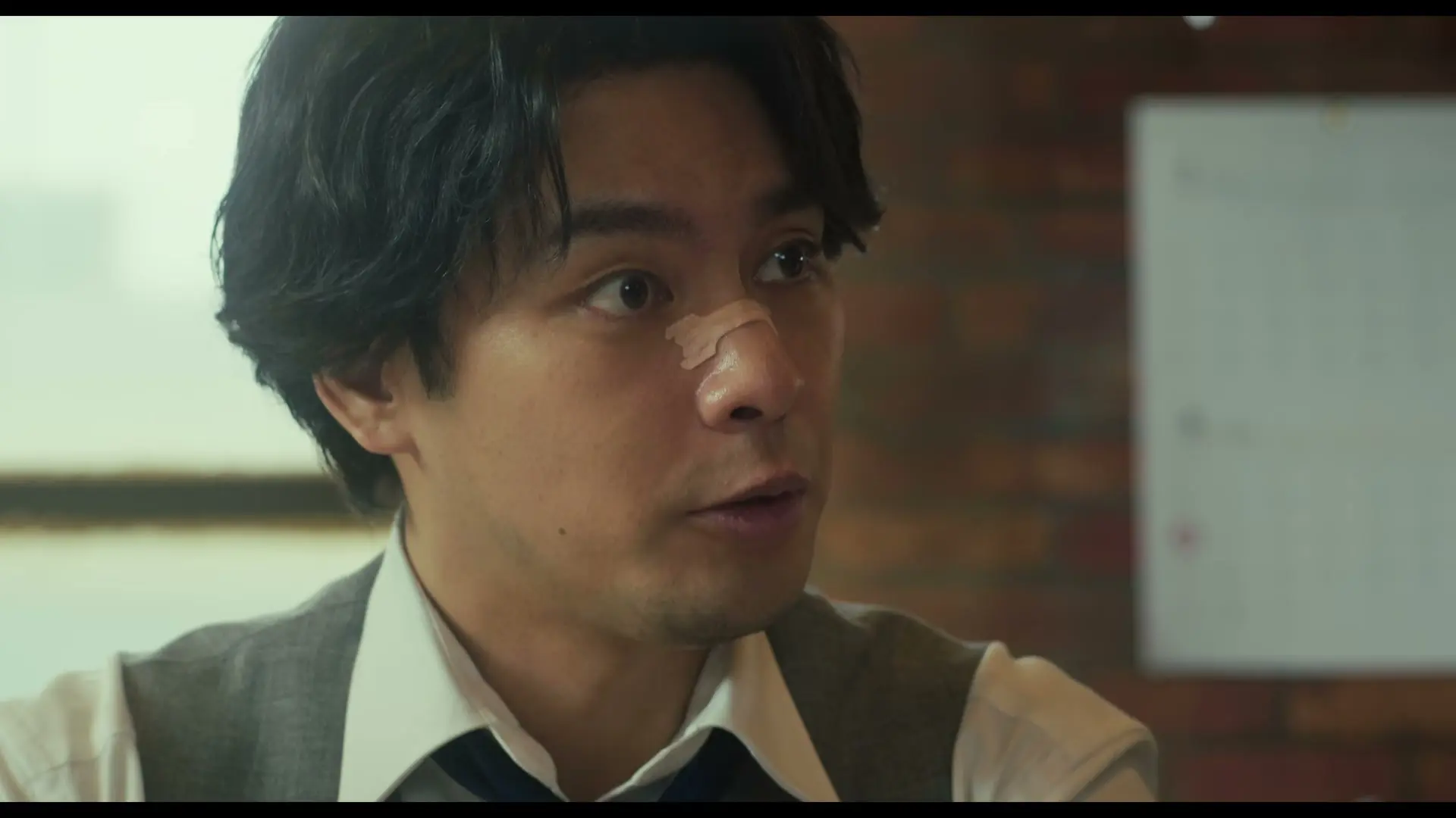 Yuya Yagira as lawyer Taiza Kujo looks to the side in the new Sins of Kujo movie teaser.