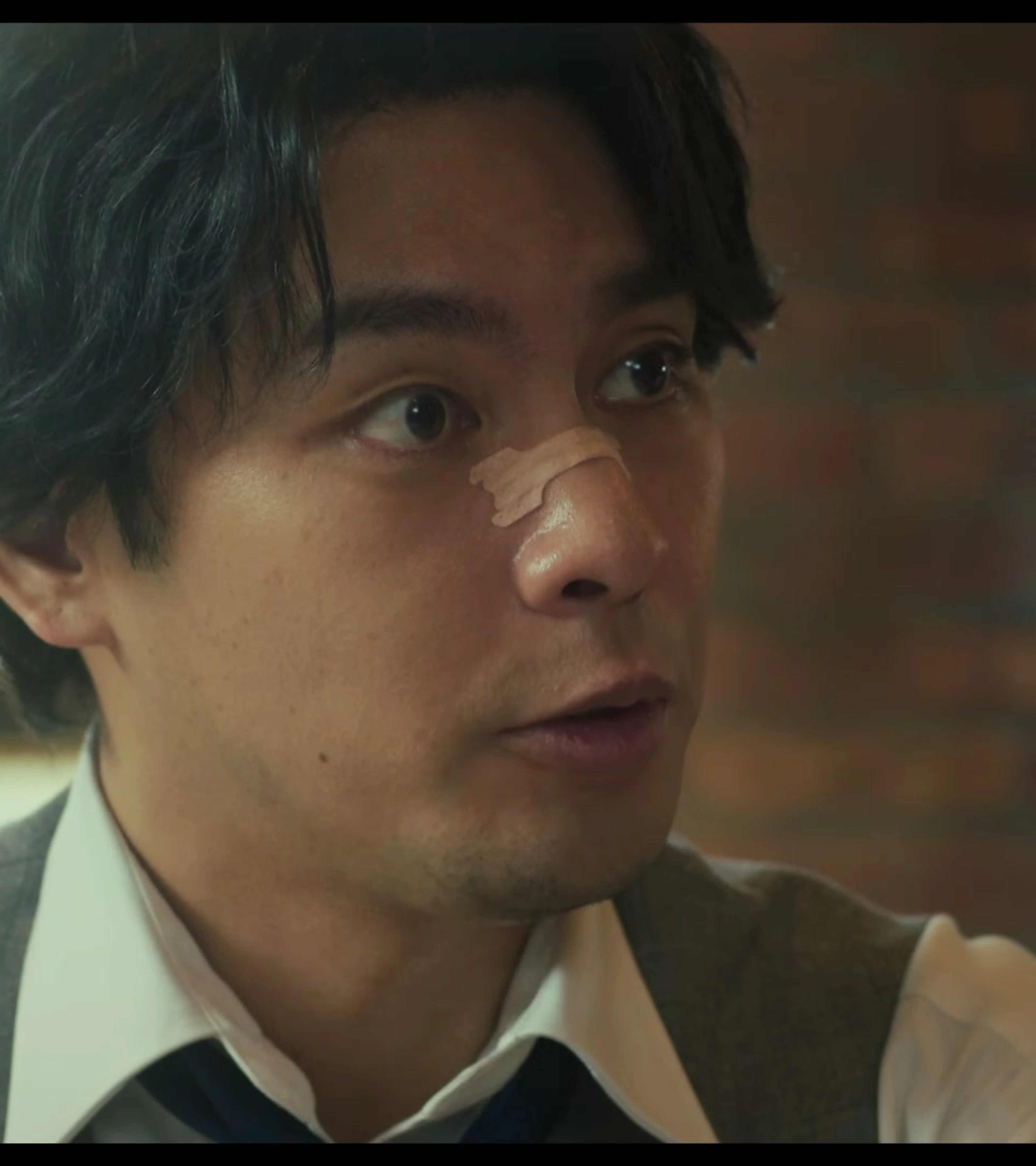 Yuya Yagira as lawyer Taiza Kujo looks to the side in the new Sins of Kujo movie teaser.
