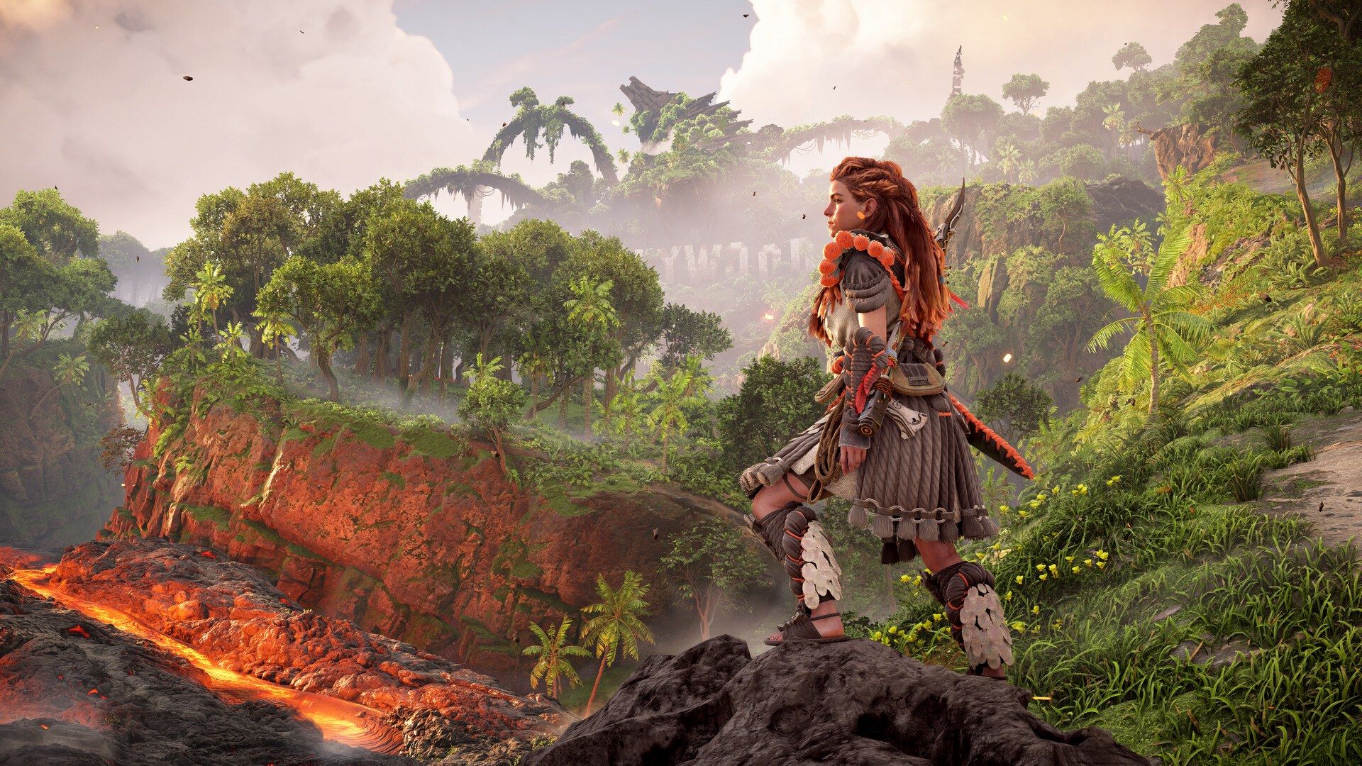 Aloy surveys a lush valley with machines in the distance.