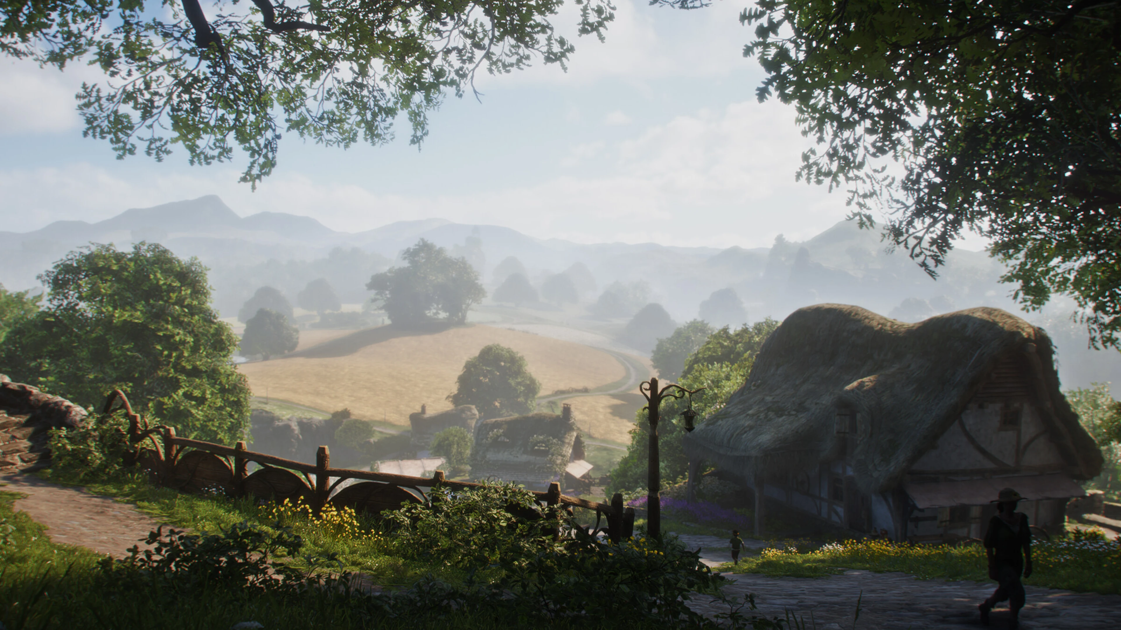 Thatched cottages in Fable’s Hamlet overlook the open countryside of Albion.