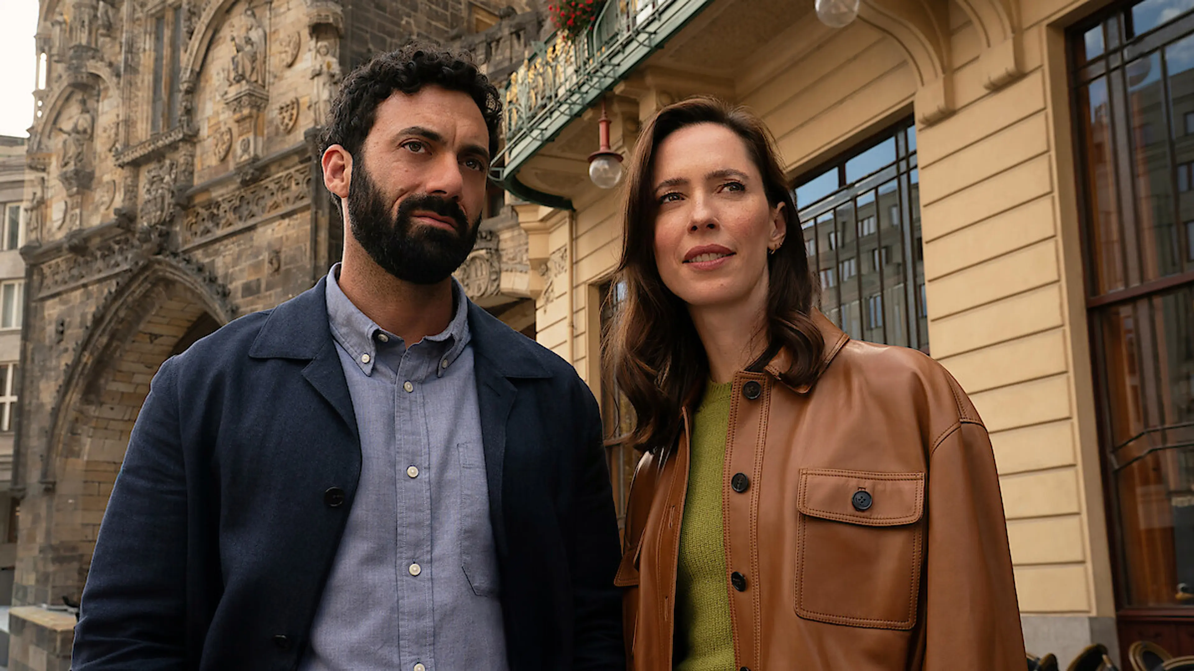 Morgan Spector as Robert Langdon and Rebecca Hall as Katherine Solomon stand together in Prague.
