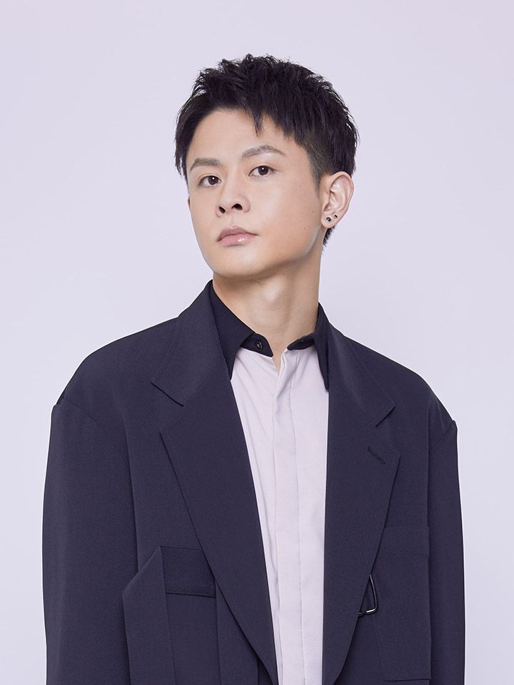 Shoya Ishige wearing a dark jacket over a white shirt.