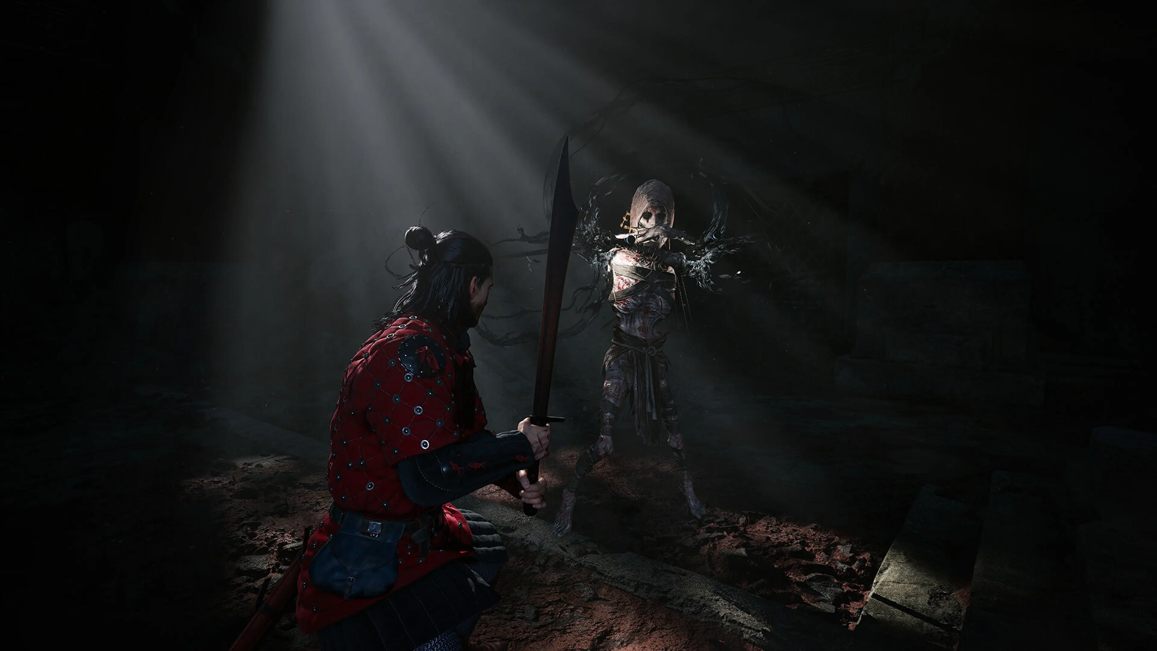 Coen holds a sword against a bandaged supernatural enemy in a dark chamber in The Blood of Dawnwalker.