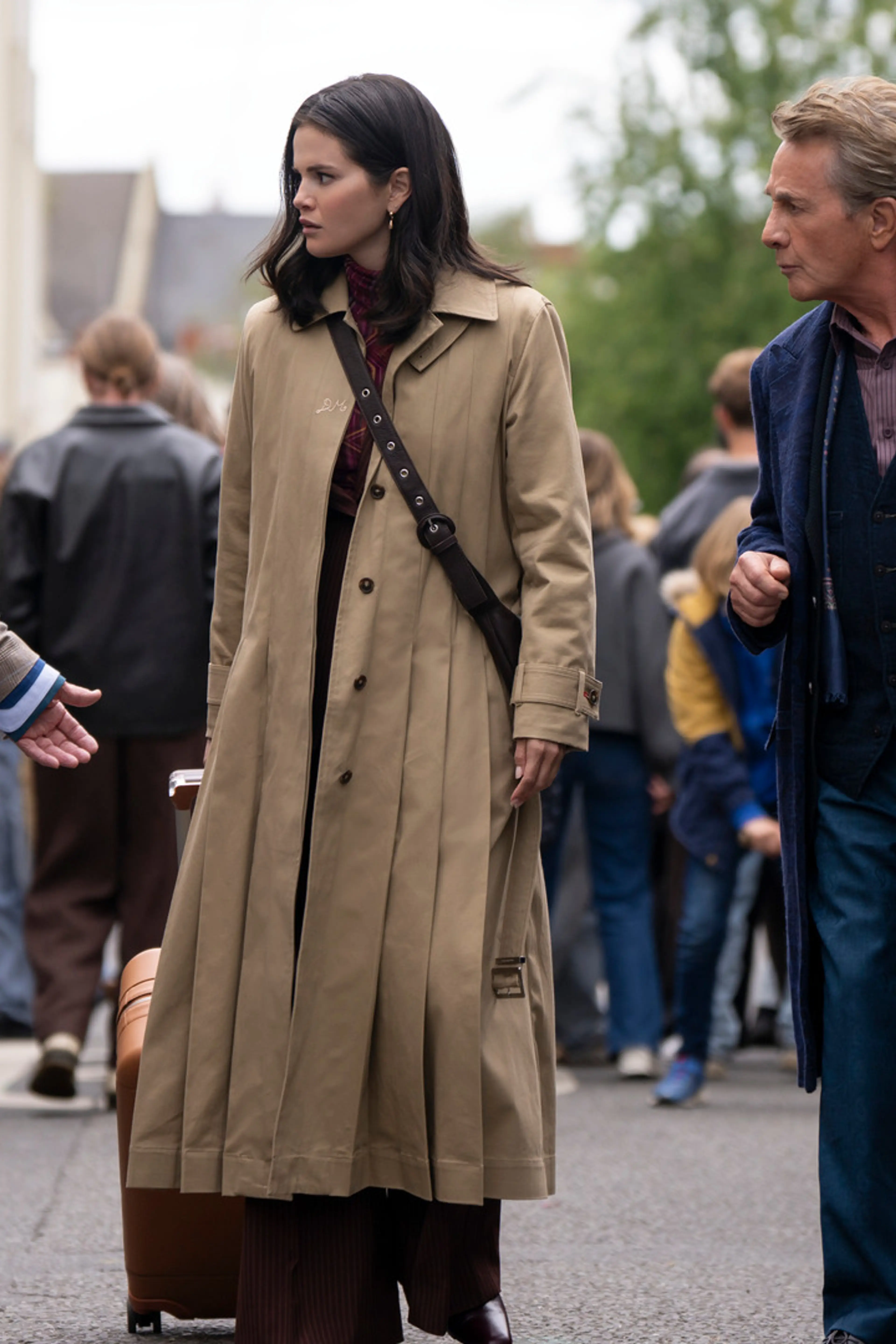 Charles, Mabel, and Oliver walk together in London in an official Only Murders in the Building Season 6 still.