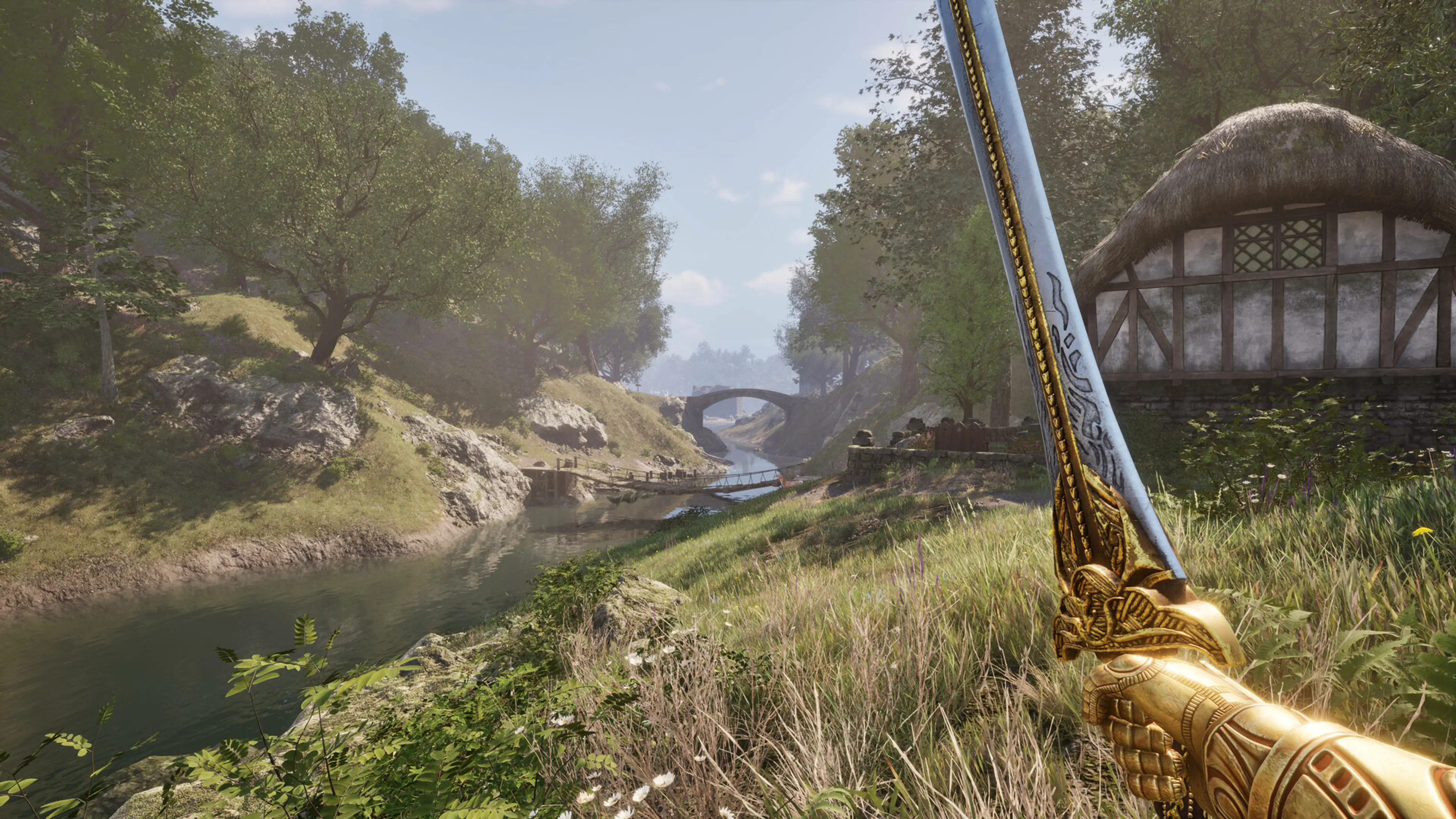 An ornate sword fills the foreground above a river valley and timber-framed village in The Elder Scrolls IV: Oblivion Remastered.